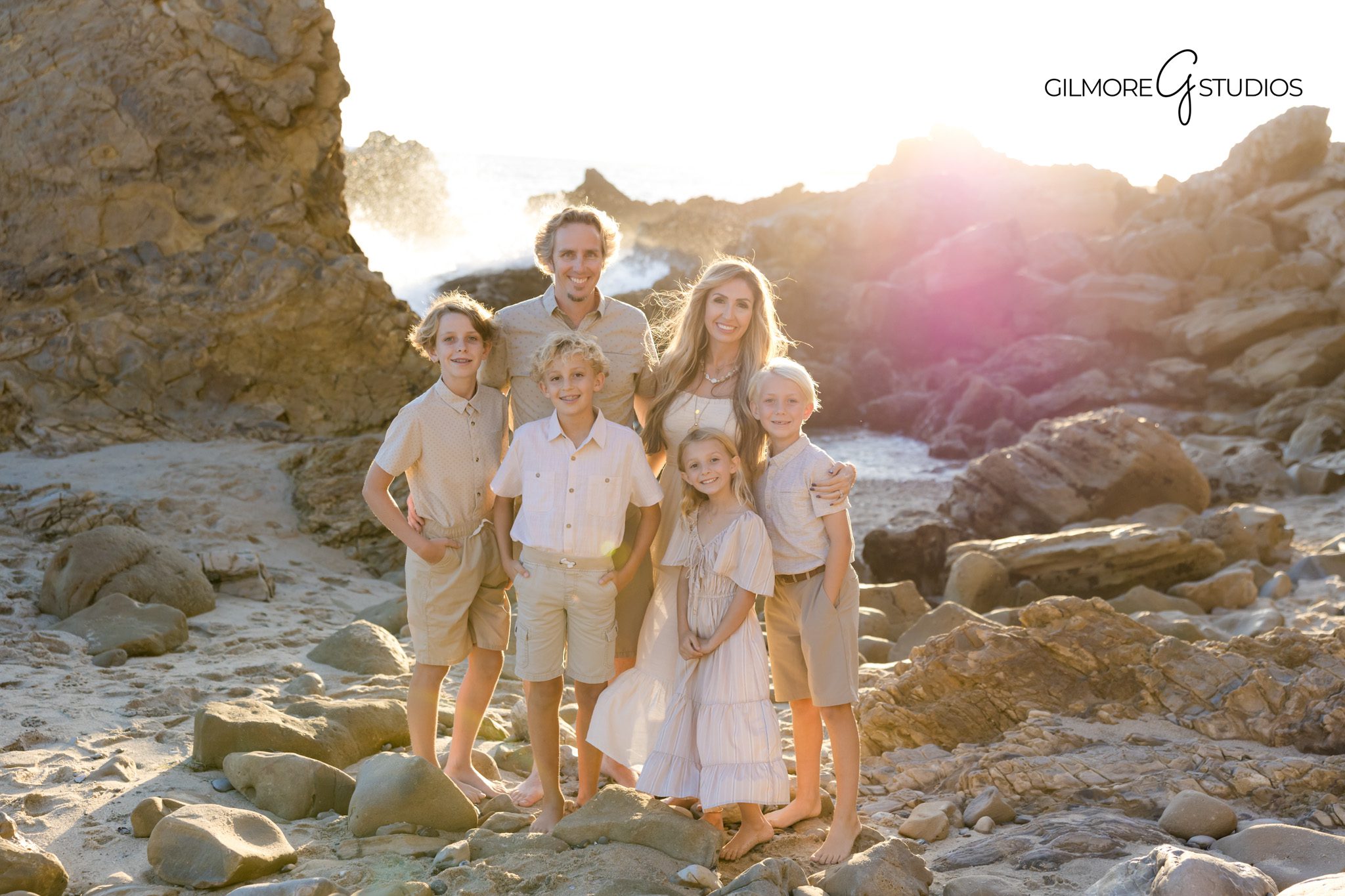 Fall family beach portraits in Newport Beach by Gilmore Studios photographer
Newport Beach family photography session during golden hour in fall