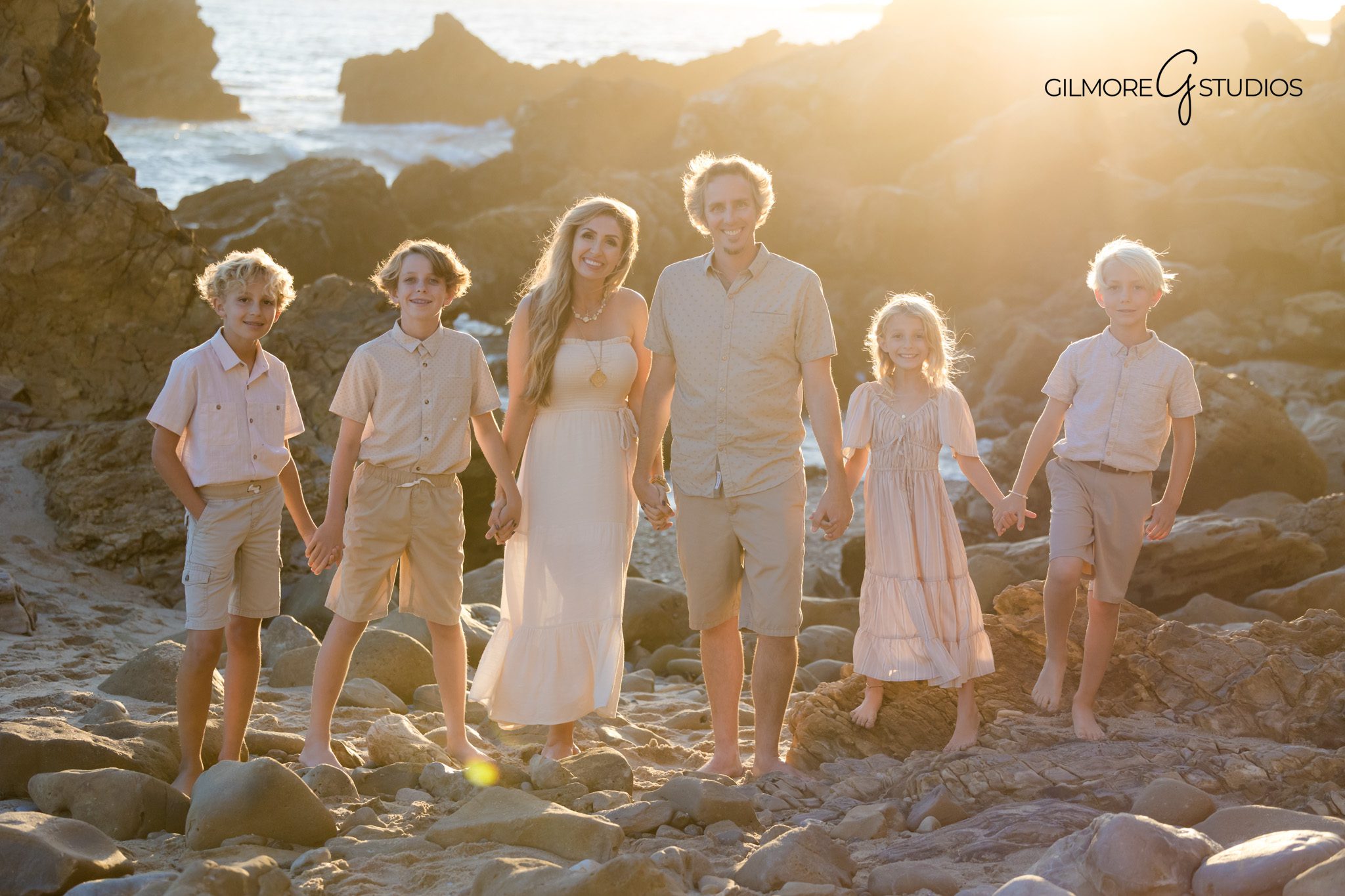 Gilmore Studios family photography at sunset on the beach
Fall family portrait on sandy shore Newport Beach photographer
