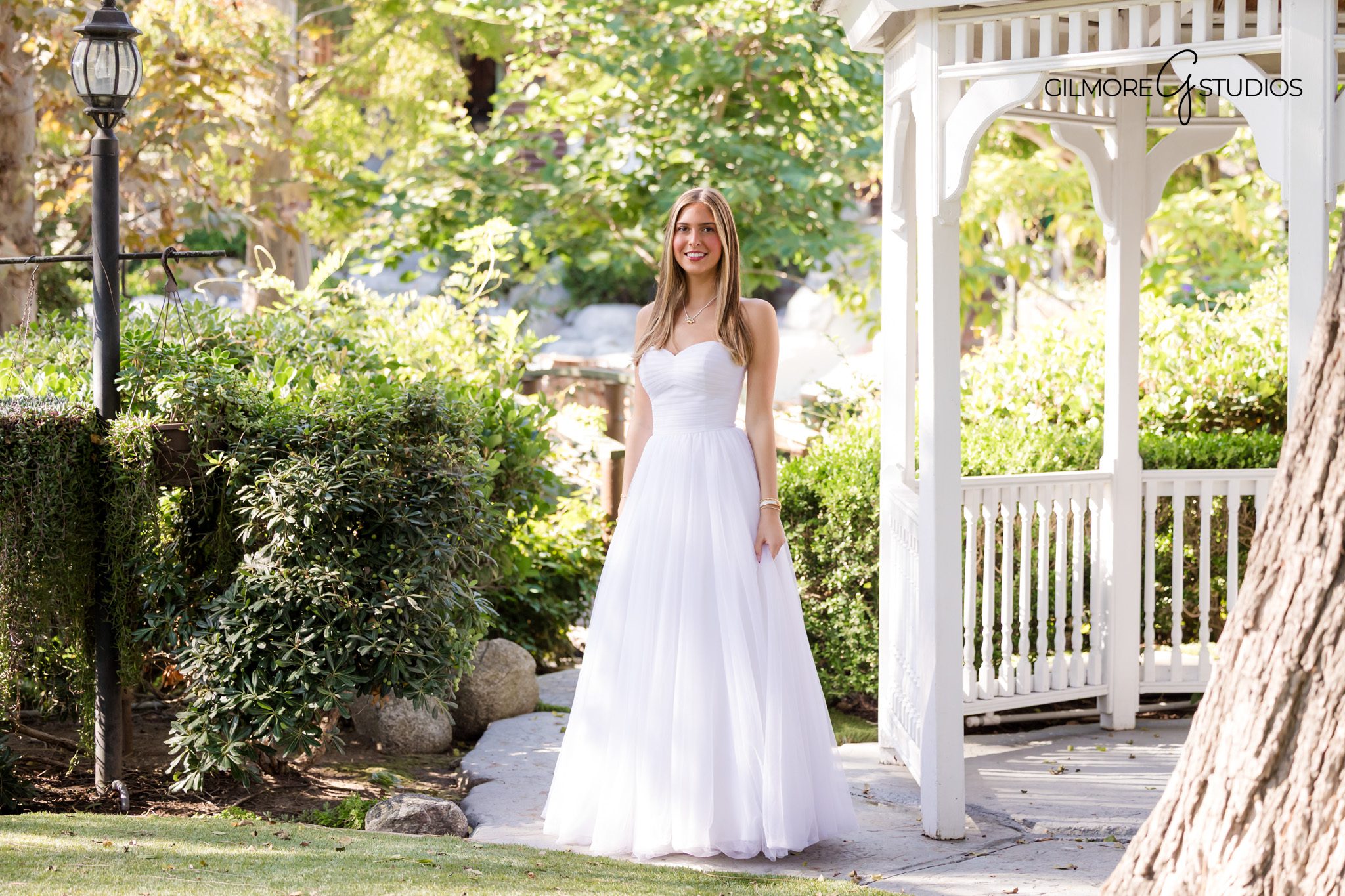 NCL debutante portrait photographer capturing elegant garden photos in Orange CA

Gilmore Studios NCL debutante photography in Orange County garden setting
