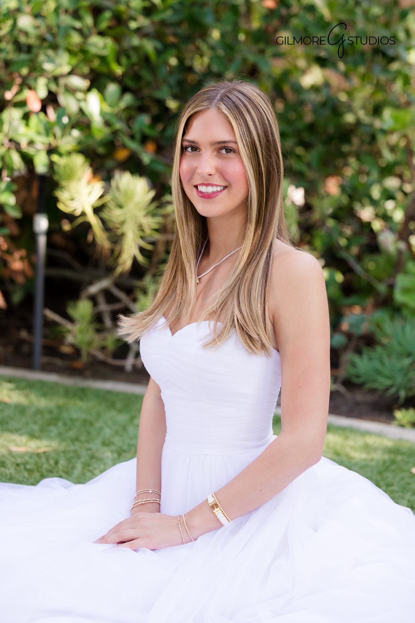 Elegant white gown debutante photography in Orange County CA

Gilmore Studios garden debutante portrait session Orange California