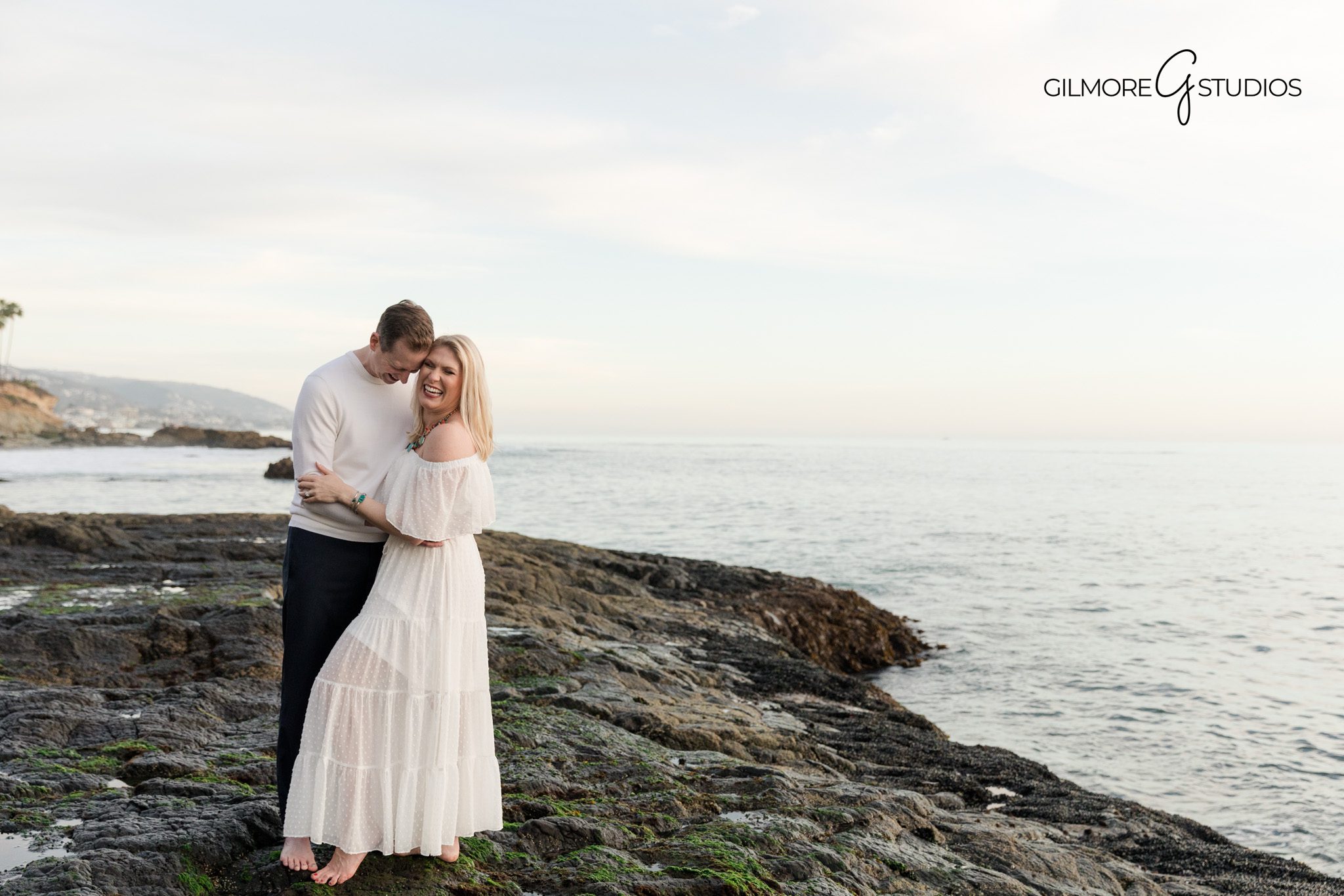 Couple holding hands walking along beach engagement photos Gilmore Studios

Gilmore Studios romantic couples photos at Newport Beach California