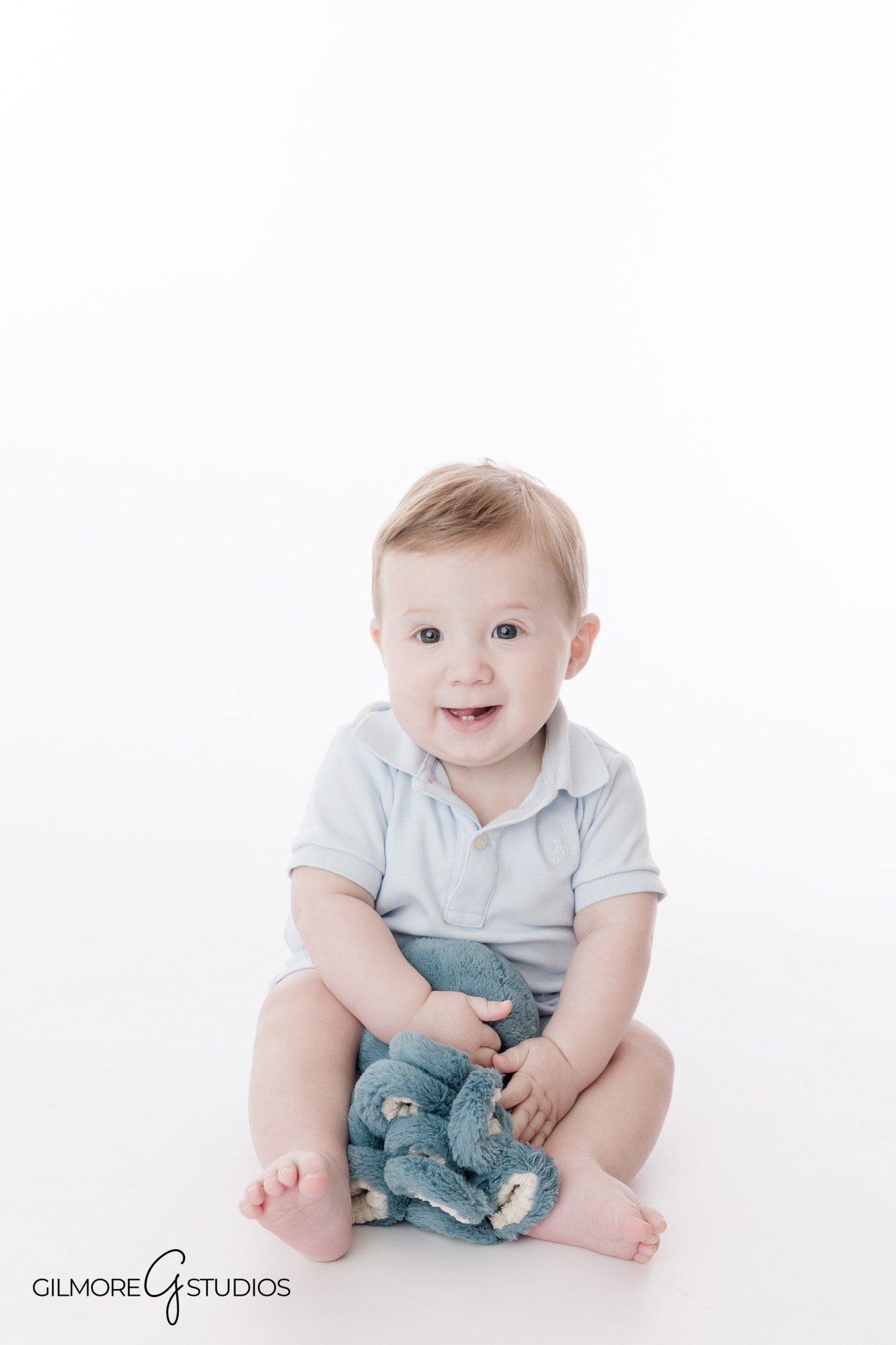 Natural baby boy portrait Gilbert studio six-month milestone session
Six-month-old baby sitting portraits in photography studio Gilbert AZ