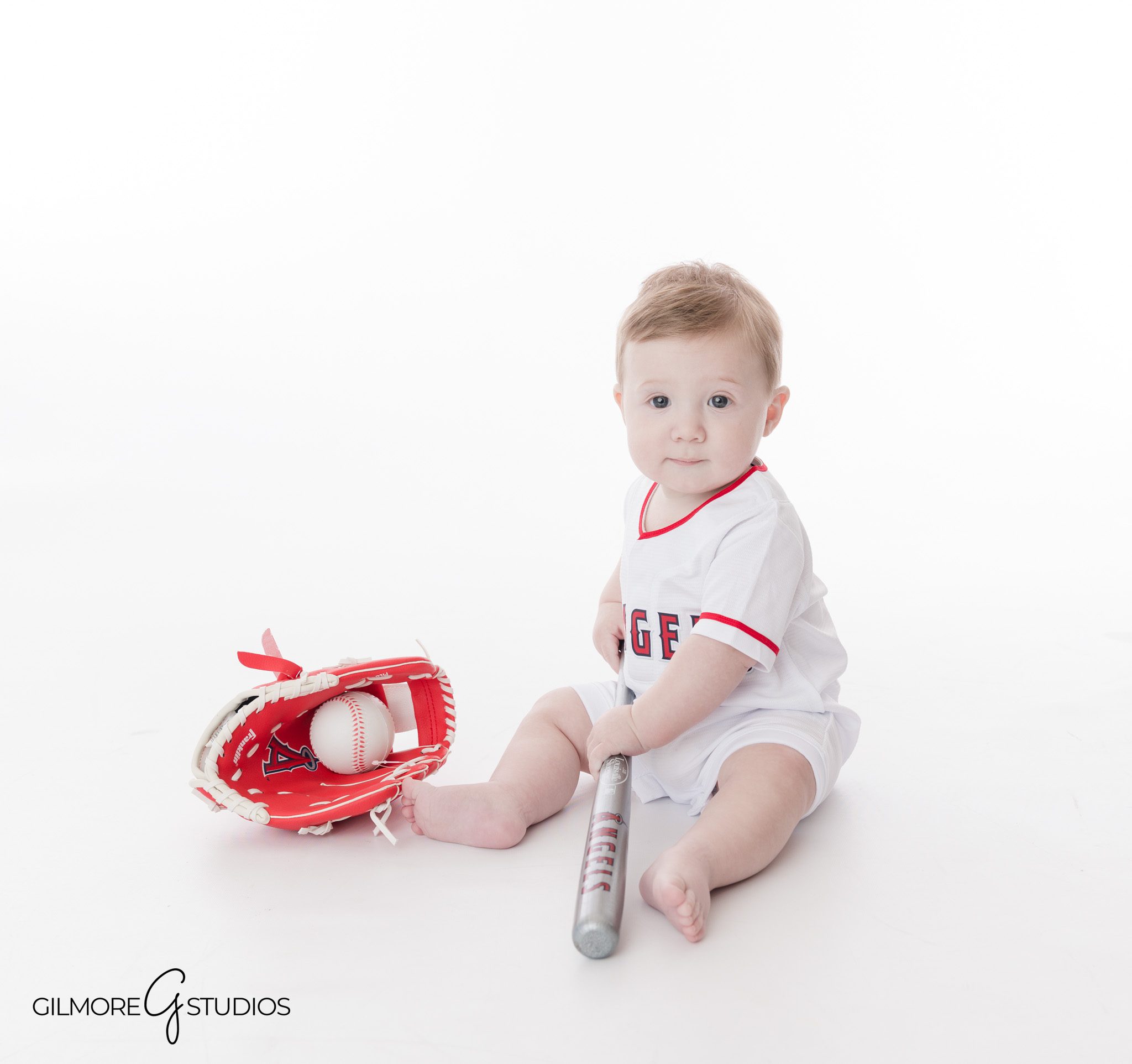 Smiling 6-month-old baby boy portrait session by Gilmore Studios photographer
Gilbert AZ baby photography studio milestone portraits for six-month session