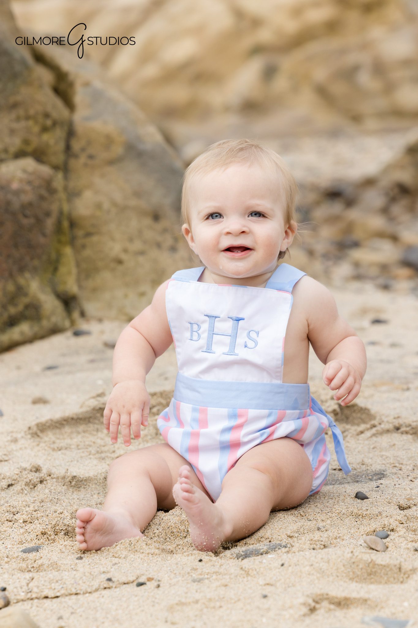 Newport Beach photographer capturing relaxed holiday beach session.
Family photography showing toddler walking on sand during portraits.