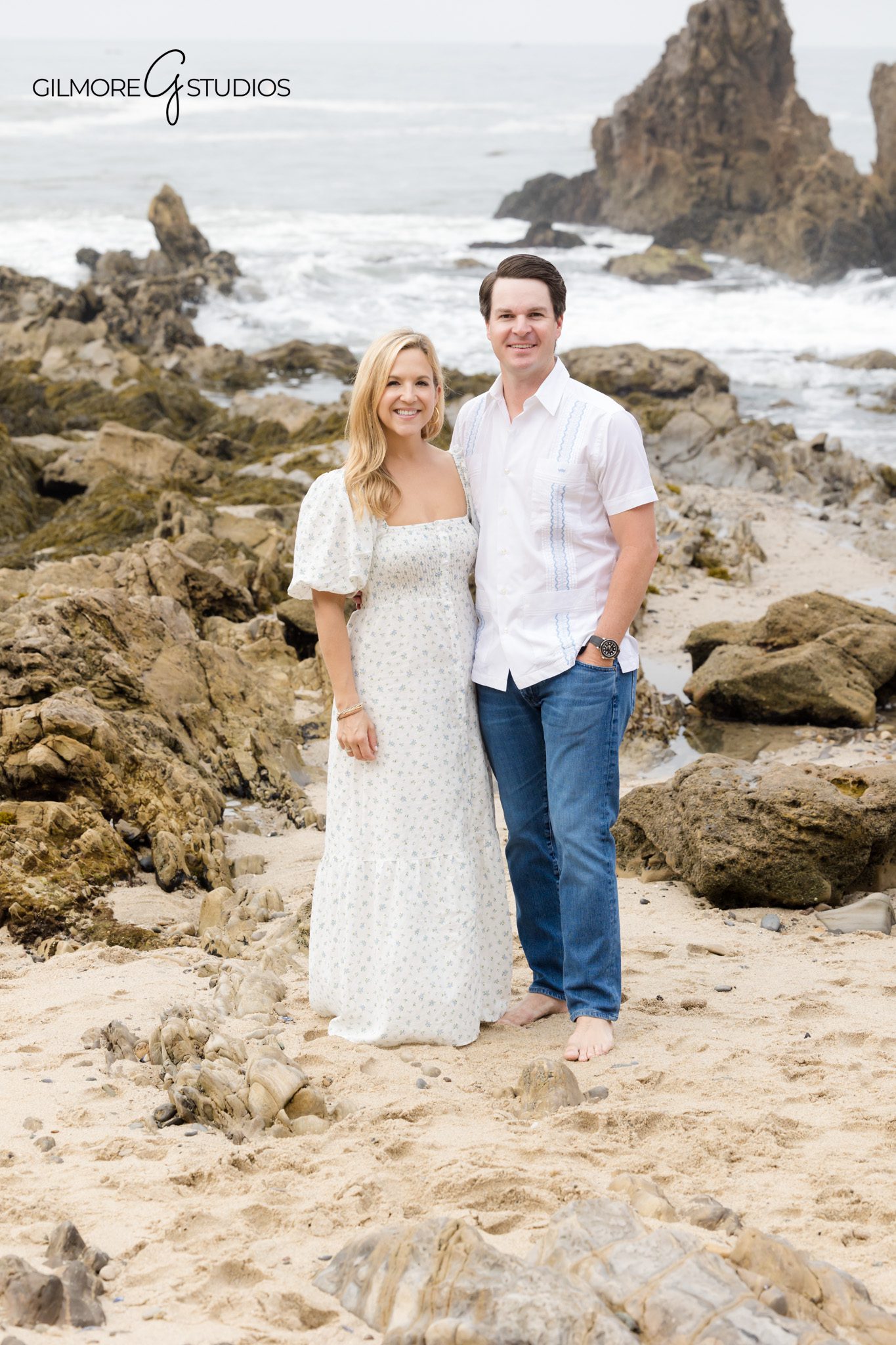 Newport Beach holiday portrait photography with glowing ocean background.
Family photographer capturing serene moment with parents and young children.