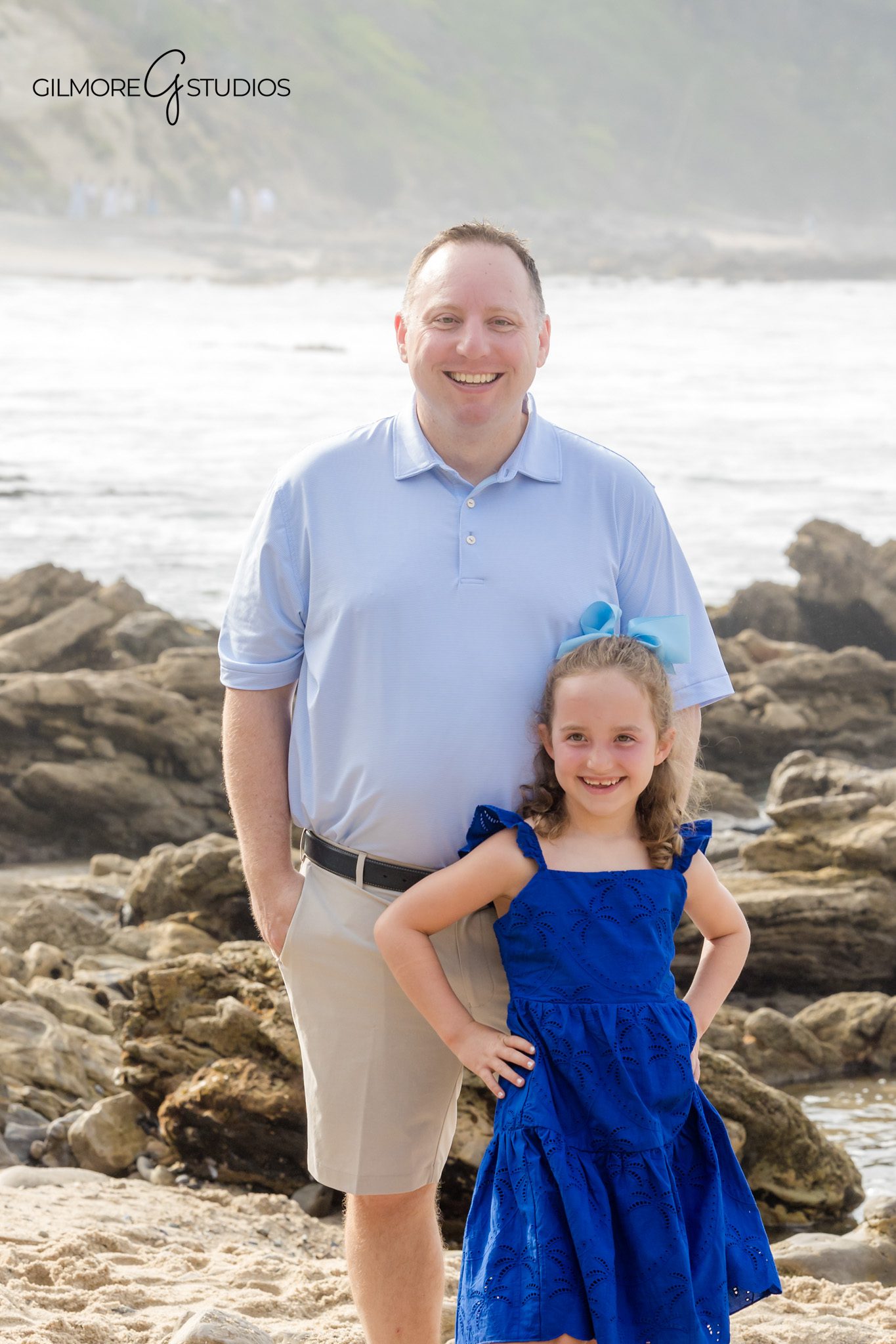 Beach family photography with soft natural holiday lighting.
Photographer documenting joyful family moment at Little Corona Beach.