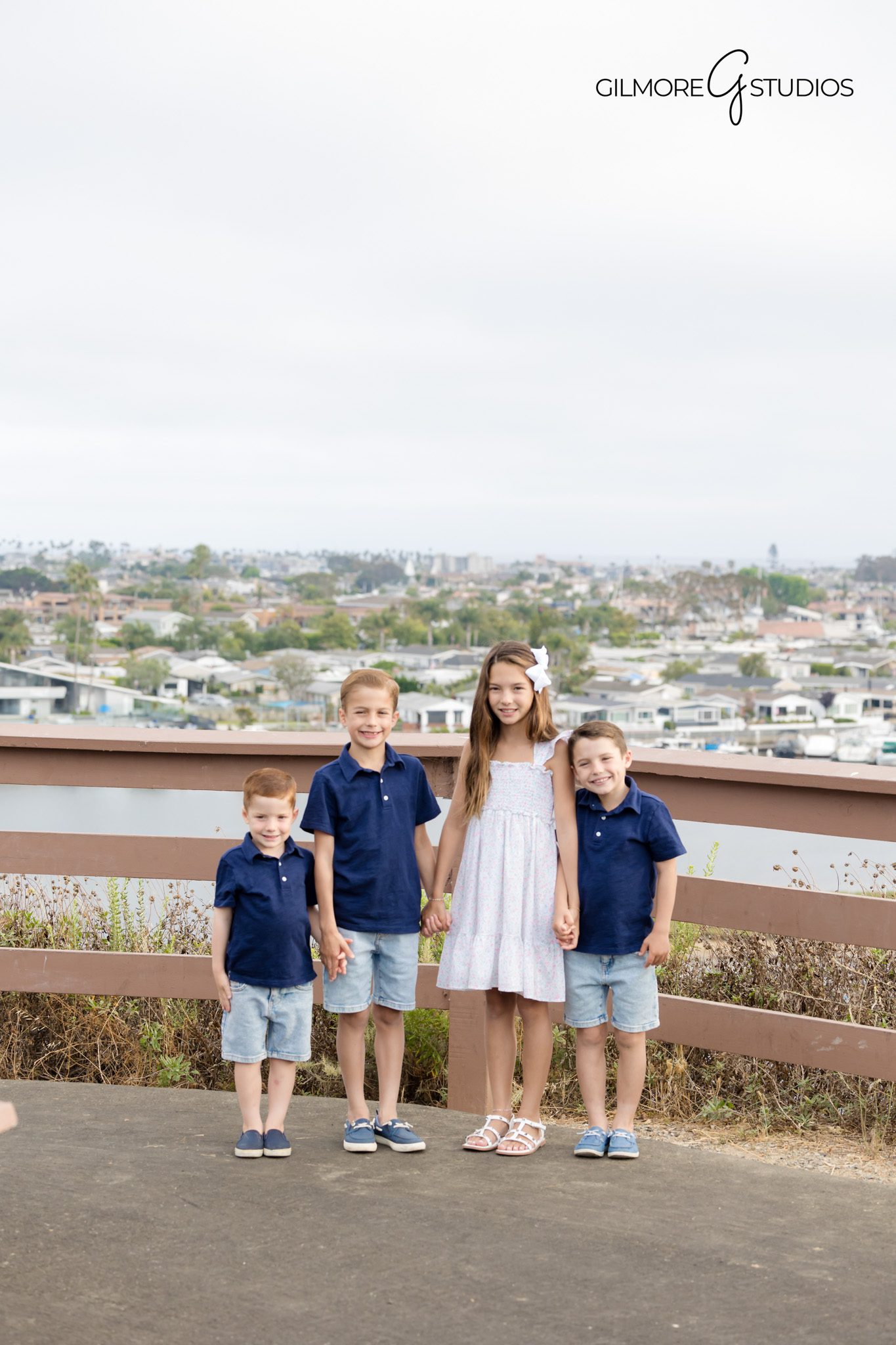 Sunset family photography captured at scenic Castaways viewpoint.

Newport Beach portrait photographer capturing joyful family moment.
