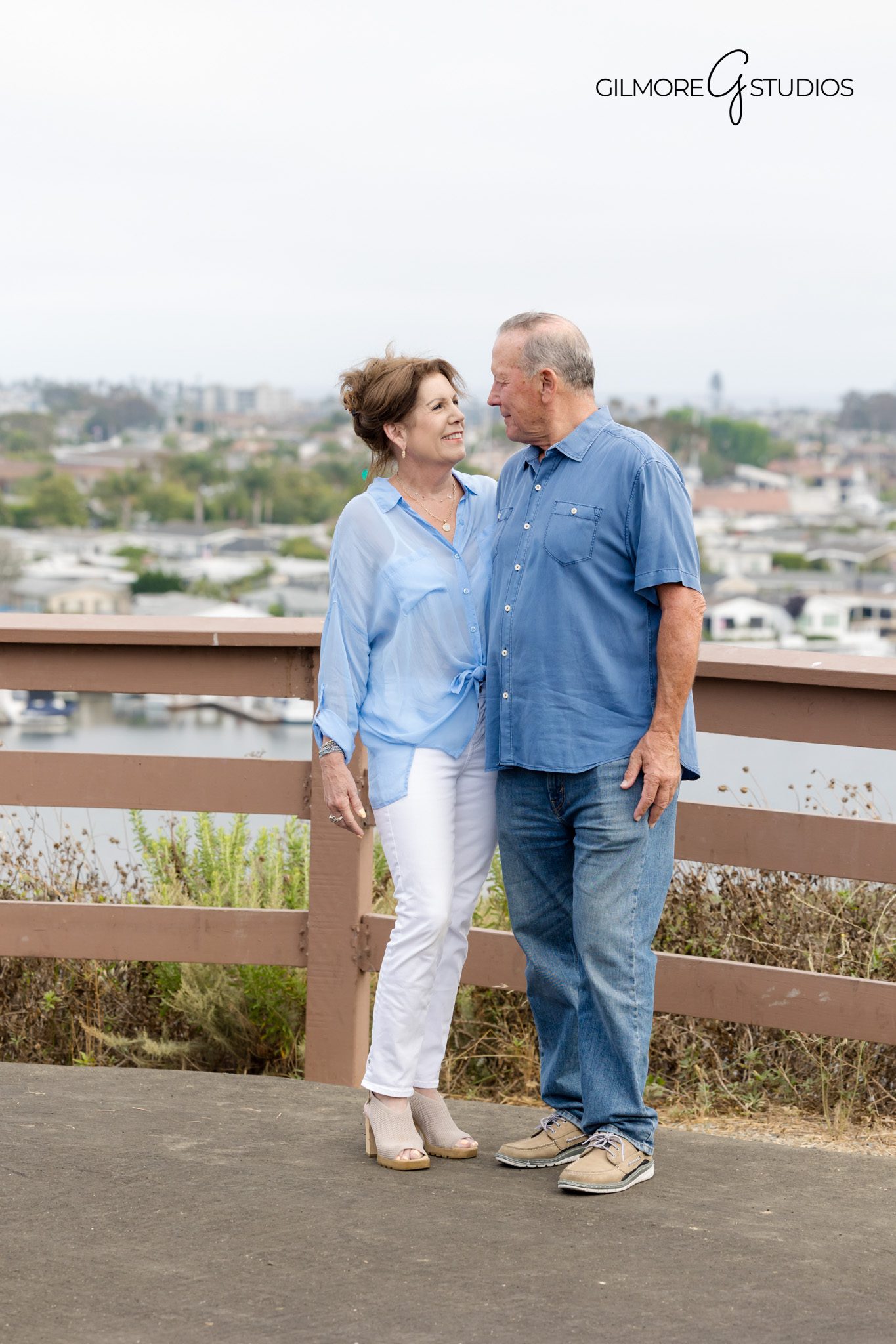Newport Beach portrait photography with dramatic scenic backdrop.

Castaways location family portrait captured in soft golden hour.