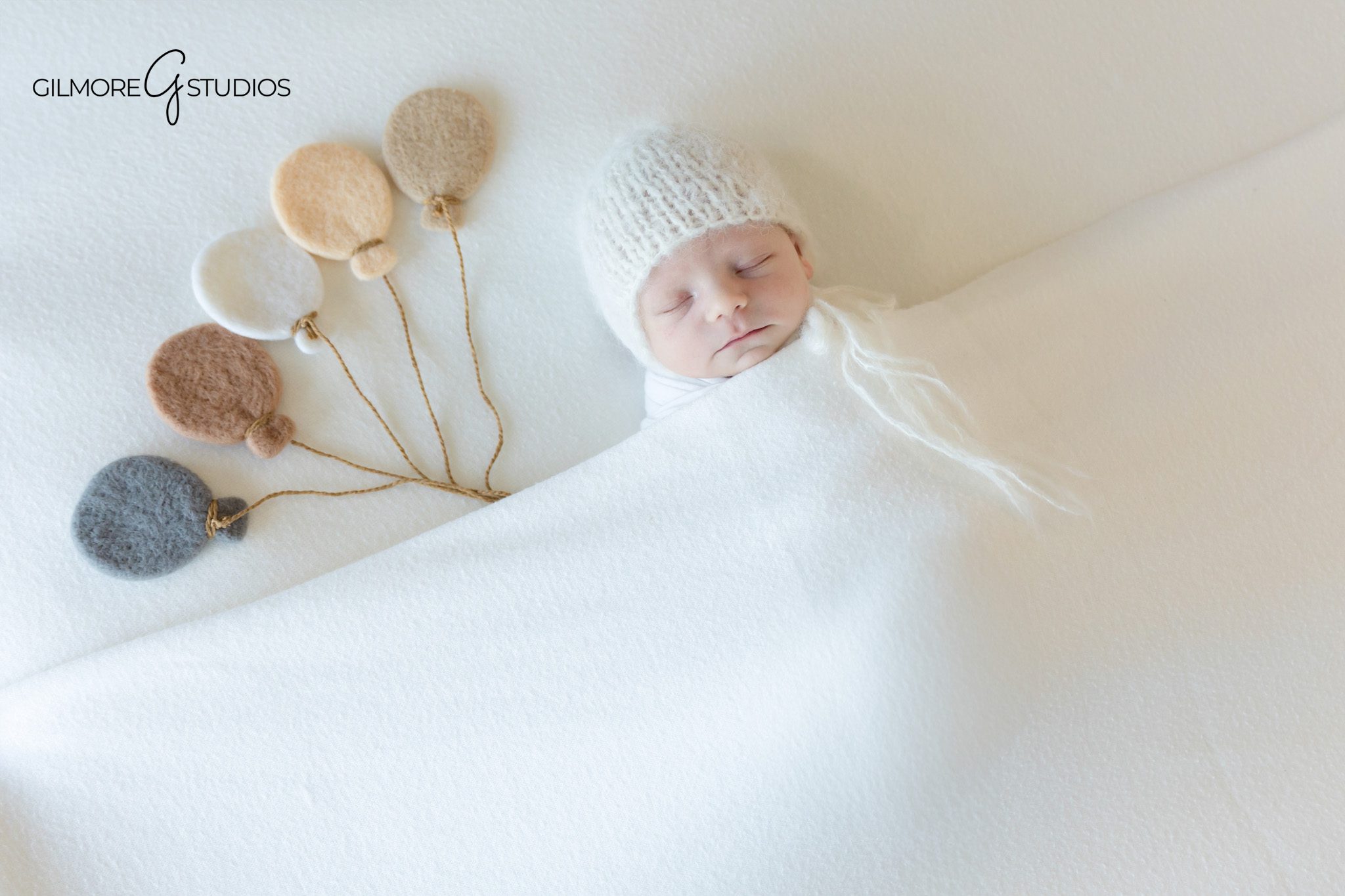 lifestyle newborn photography with baby posed safely and naturally,

newborn portrait photographer documenting first family photos in san diego,