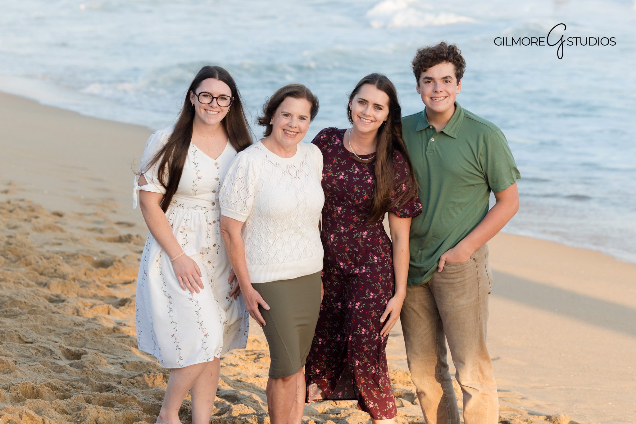 Newport Beach portrait photographer capturing candid family moment by the water.

Family photography at Newport Beach Pier showing parents walking with children.