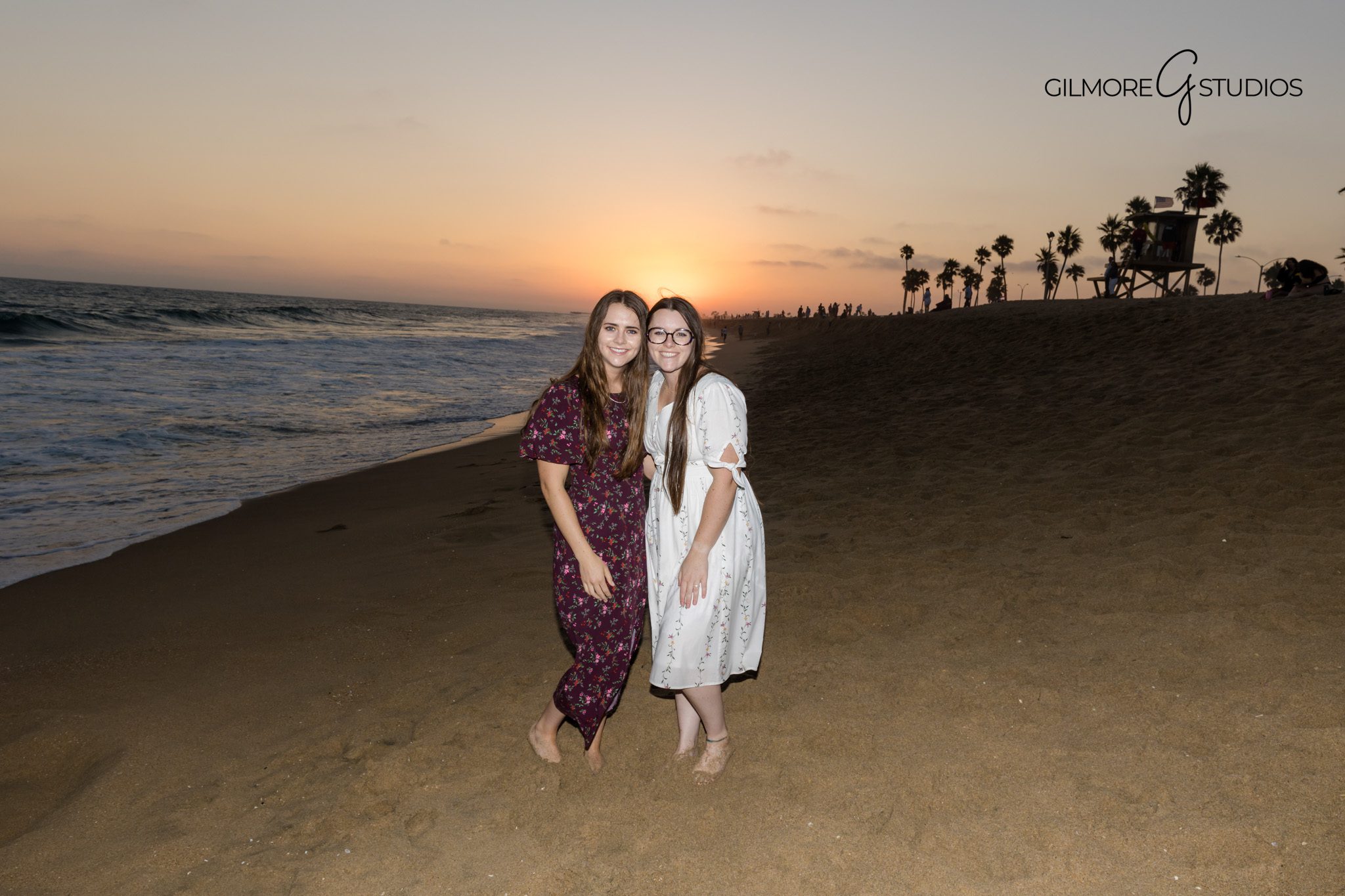 Newport Beach family photography showing golden light on sandy beach.

Photographer capturing sweet moment between parent and child at the pier.