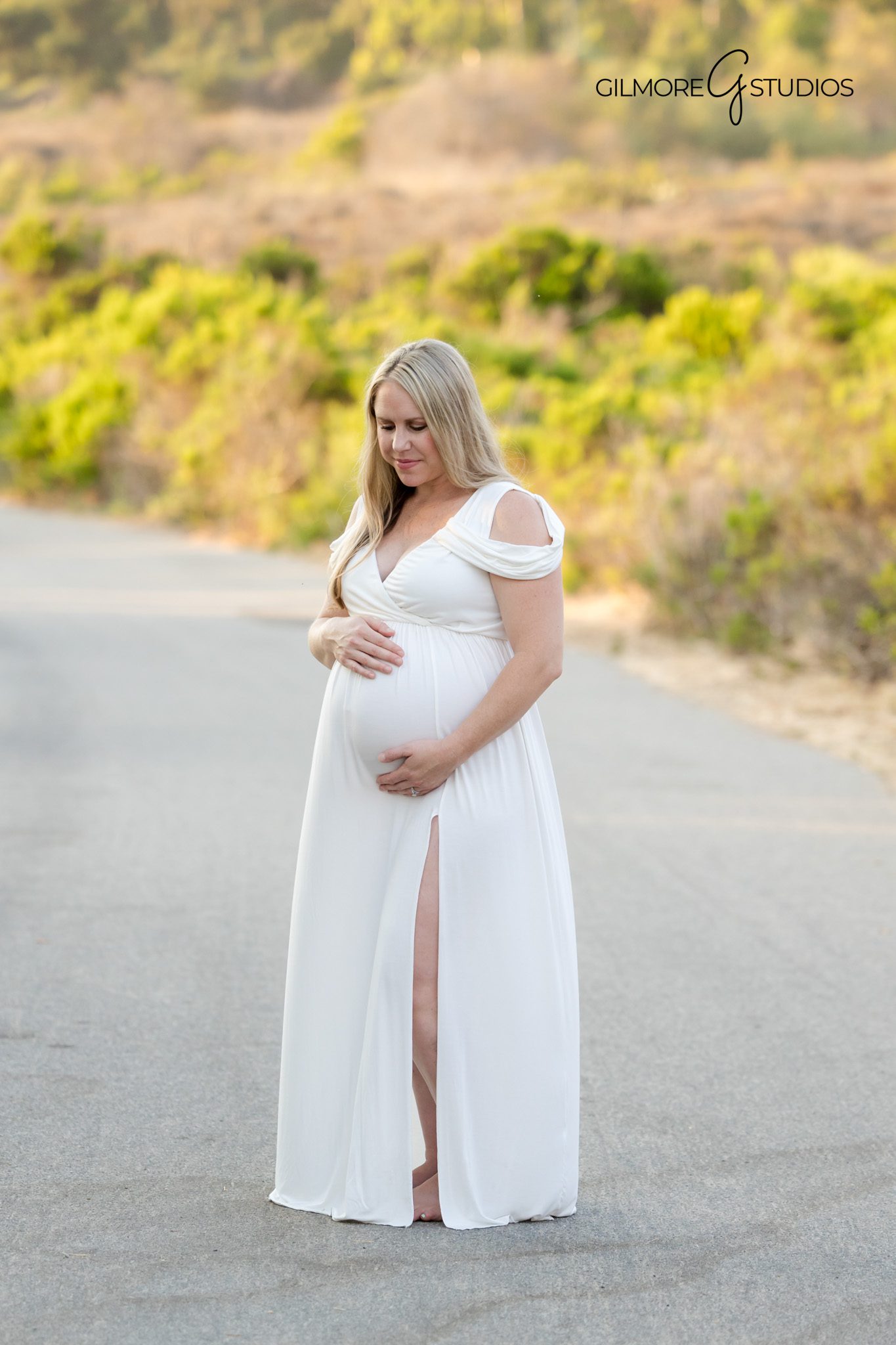 Maternity photography showing expecting mother looking toward ocean horizon,

Crystal Cove beach portrait photographer capturing warm and peaceful moment,