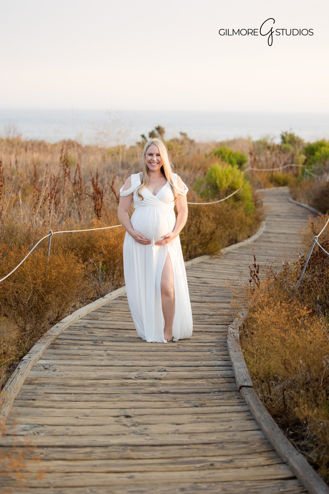 Crystal Cove photographer capturing soft and natural beach maternity session,

Maternity portrait photography with golden hour light in Orange County,