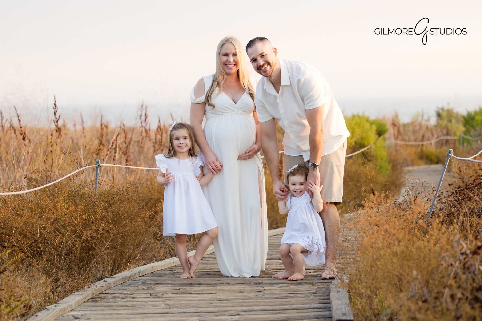 Maternity photographer capturing barefoot beach session at Crystal Cove,

Oceanfront maternity photography with glowing sunset light in Orange County,