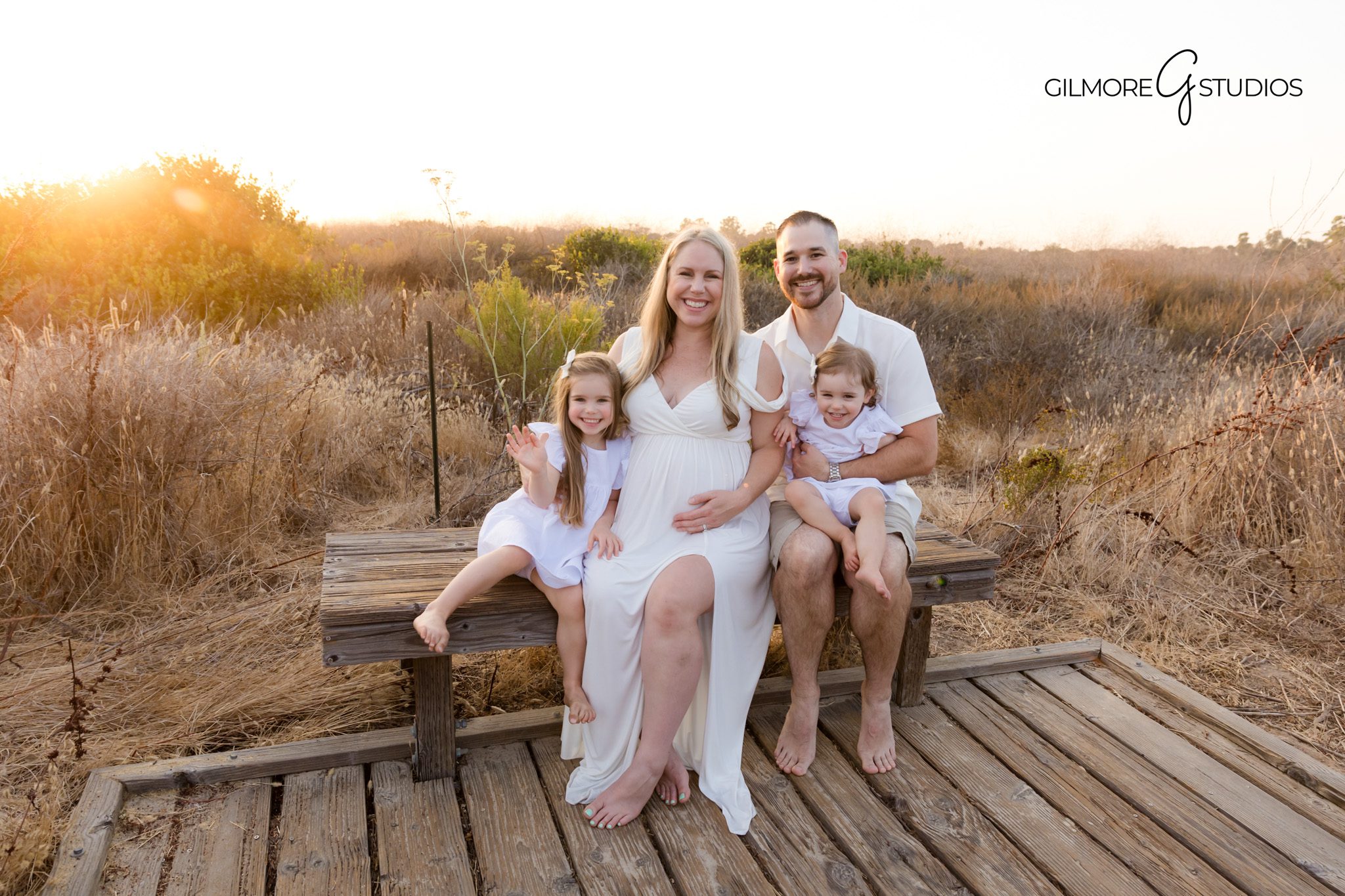 Crystal Cove portrait photographer capturing serene maternity moment,

Orange County maternity photography with long dress flowing in wind,
