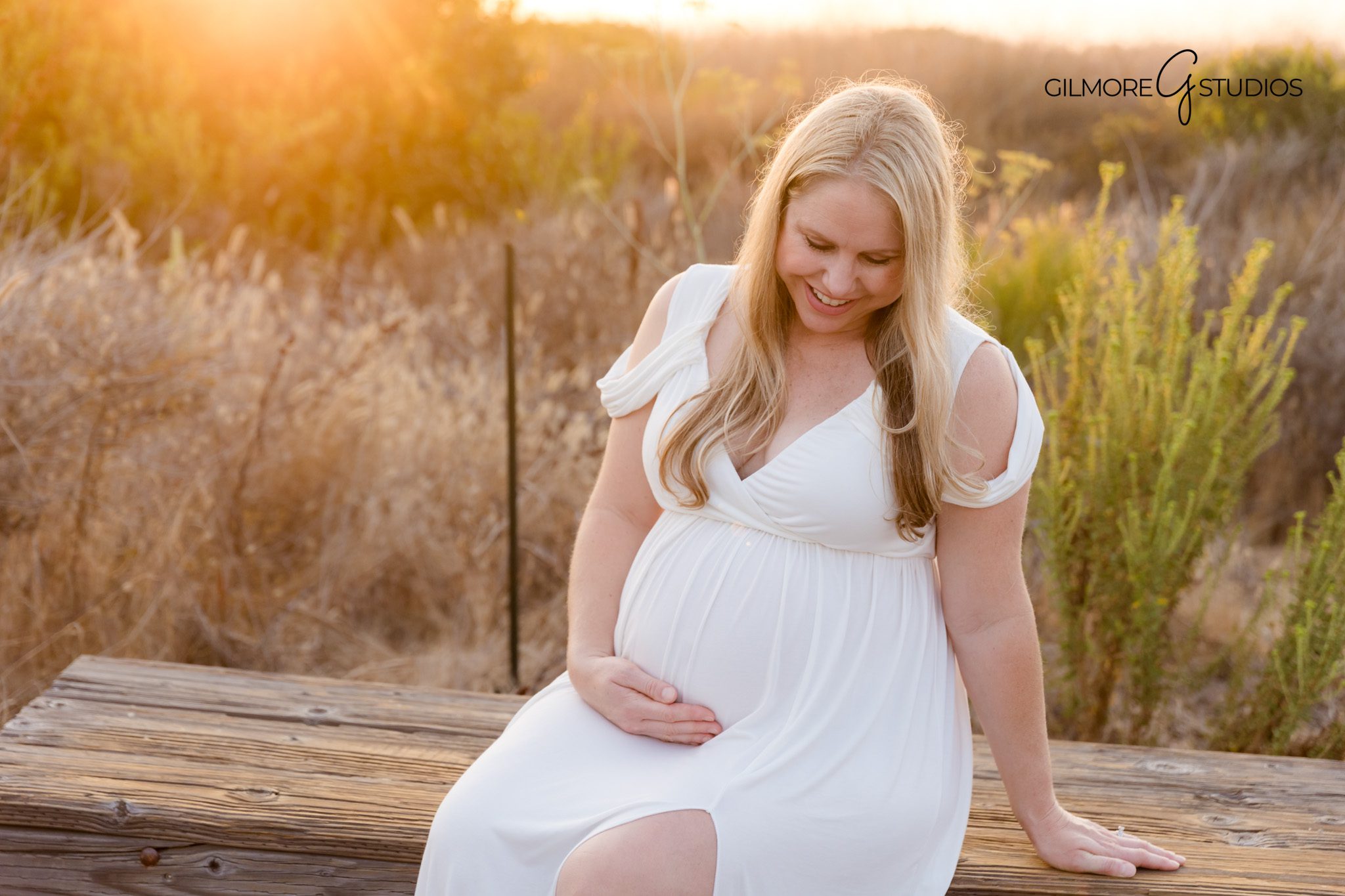 Crystal Cove maternity photos showing coastal rocks and soft sunlight,

Orange County photographer capturing romantic pregnancy portraits by cliffs,
