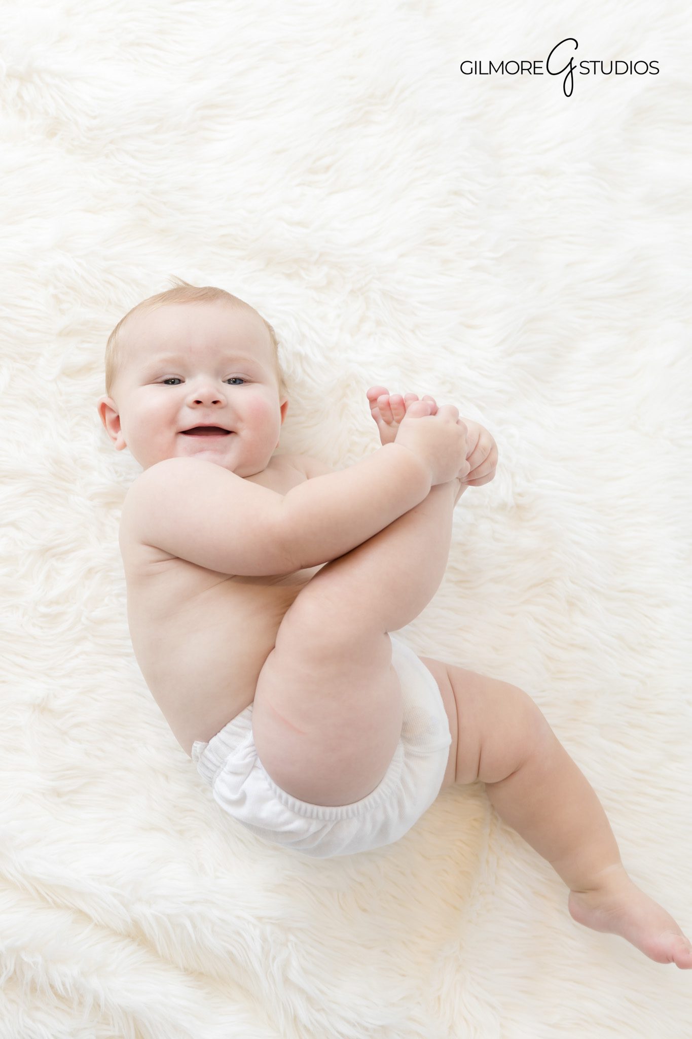 Gilmore Studios milestone photographer capturing baby’s sitting stage

Clean white studio baby portrait photography in OC