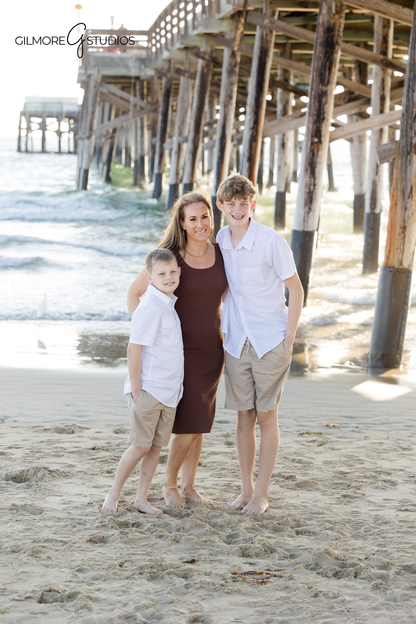Professional OC family photographer capturing large group beach portrait.

Newport Beach photographer documenting family connection and joy.