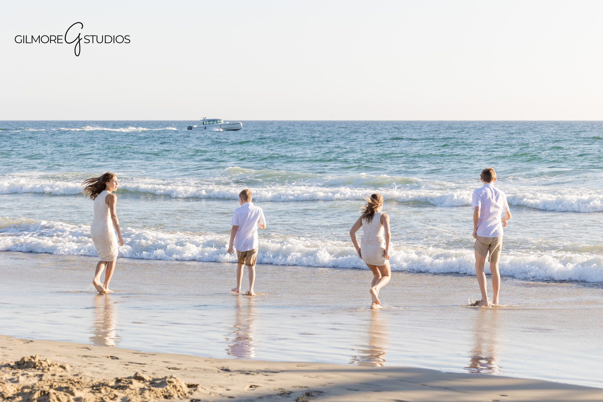 Newport Beach photographer capturing candid moments between cousins.

Orange County extended family portrait with Pacific Ocean in background.