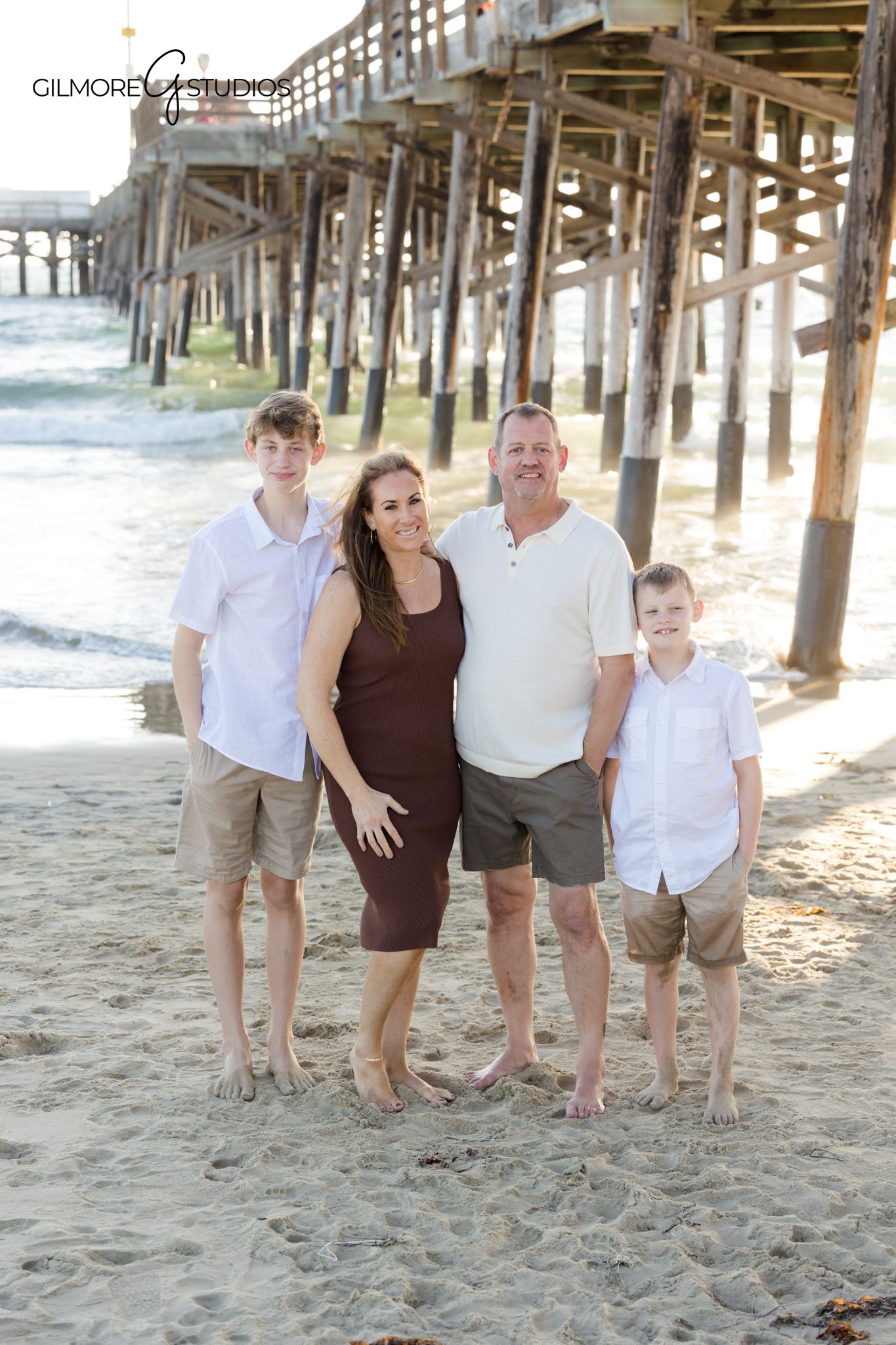 Newport Beach Pier photographer capturing playful family candid.

Multigenerational family photography using soft California sunset light.