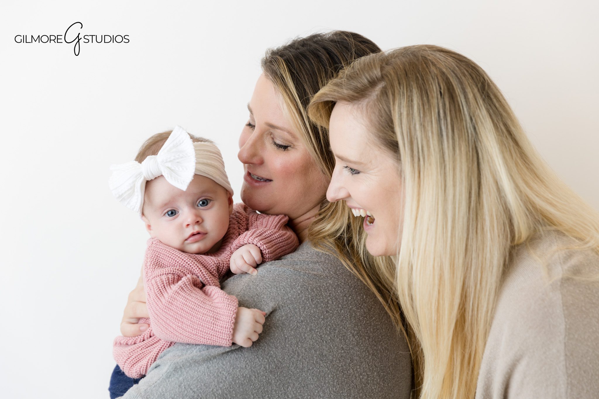 Two month old baby photography with classic white backdrop.
Orange County studio photographer capturing peaceful infant pose.
