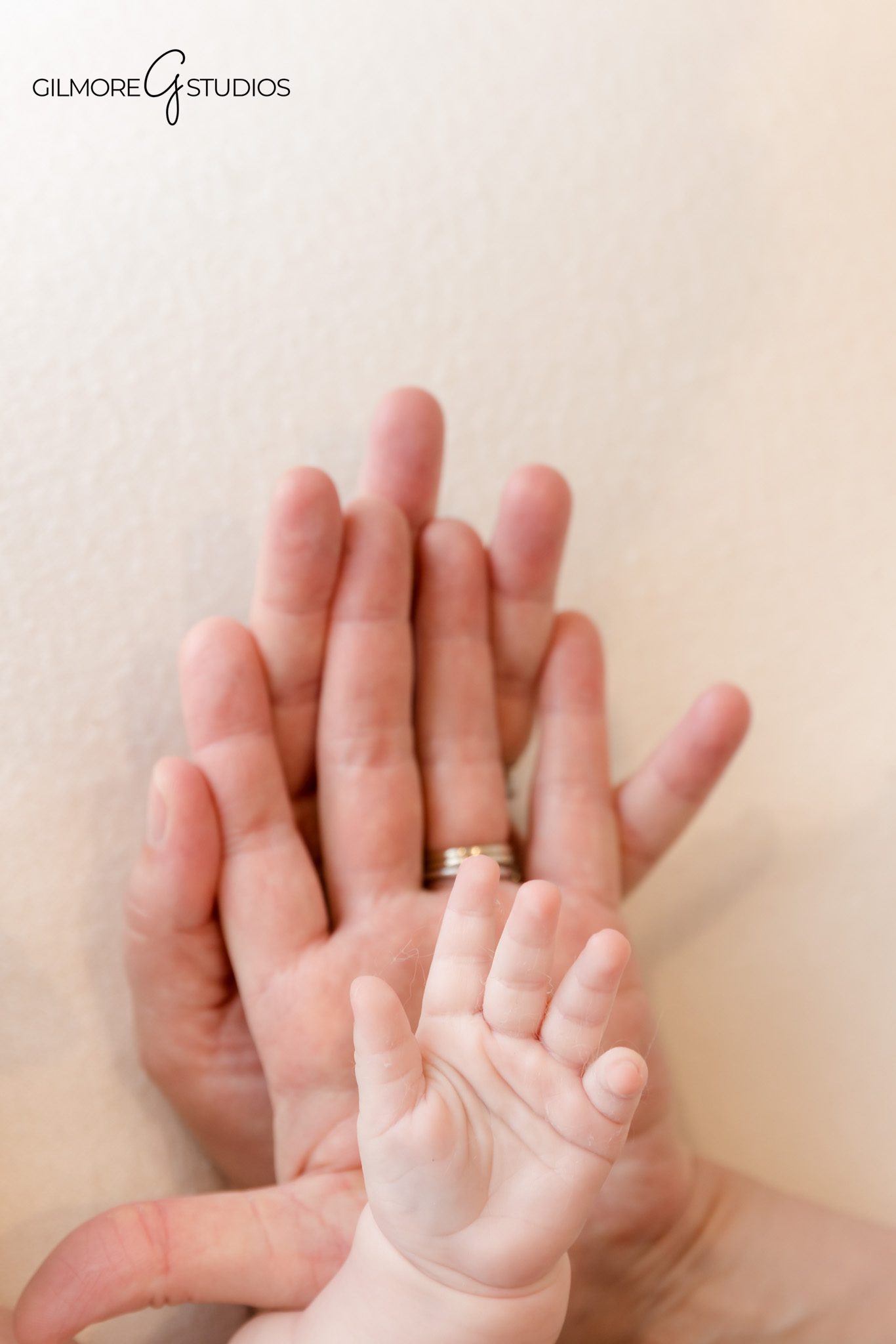 Minimalist baby portrait captured by professional photographer.
Sweet newborn photography of two month old with relaxed pose.