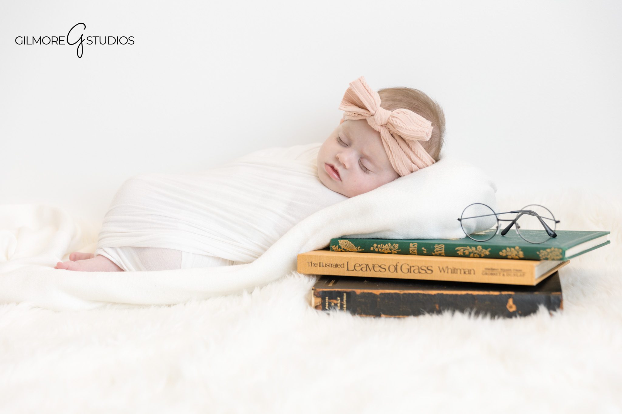 Two month old baby looking up during milestone photo session.
Orange County portrait photographer capturing gentle baby profile.