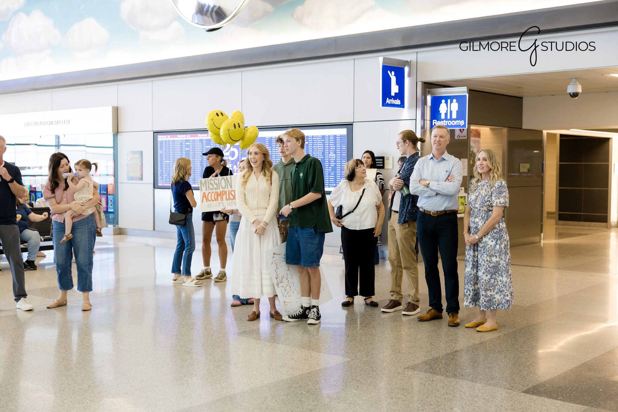LDS missionary welcome home photography session Phoenix Arizona Gilmore Studios

Missionary family hug captured at Phoenix Airport by Gilmore Studios photographer