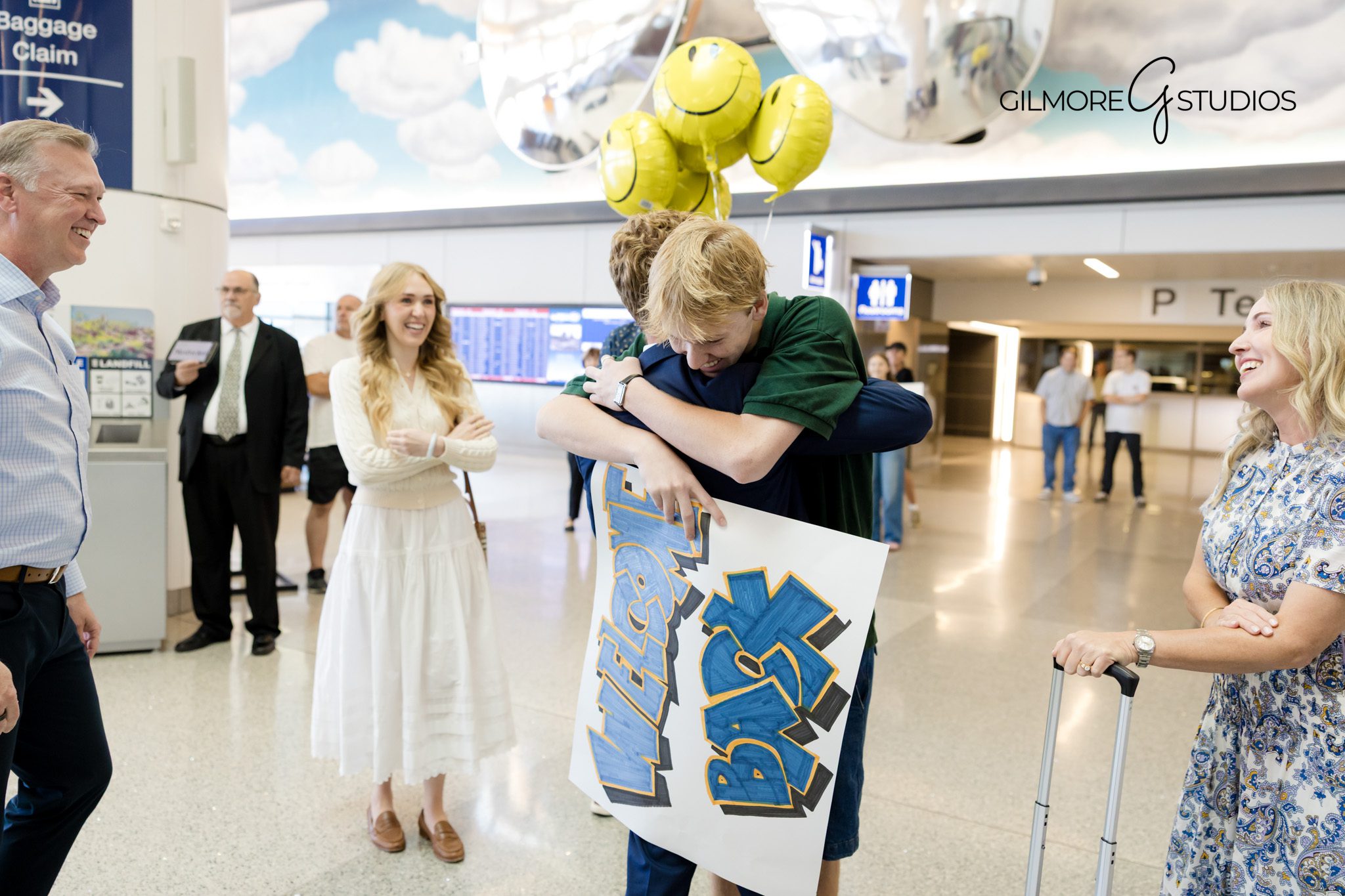 LDS missionary homecoming photographer capturing emotional reunion in Phoenix AZ

Gilmore Studios family photography at Phoenix Sky Harbor LDS homecoming