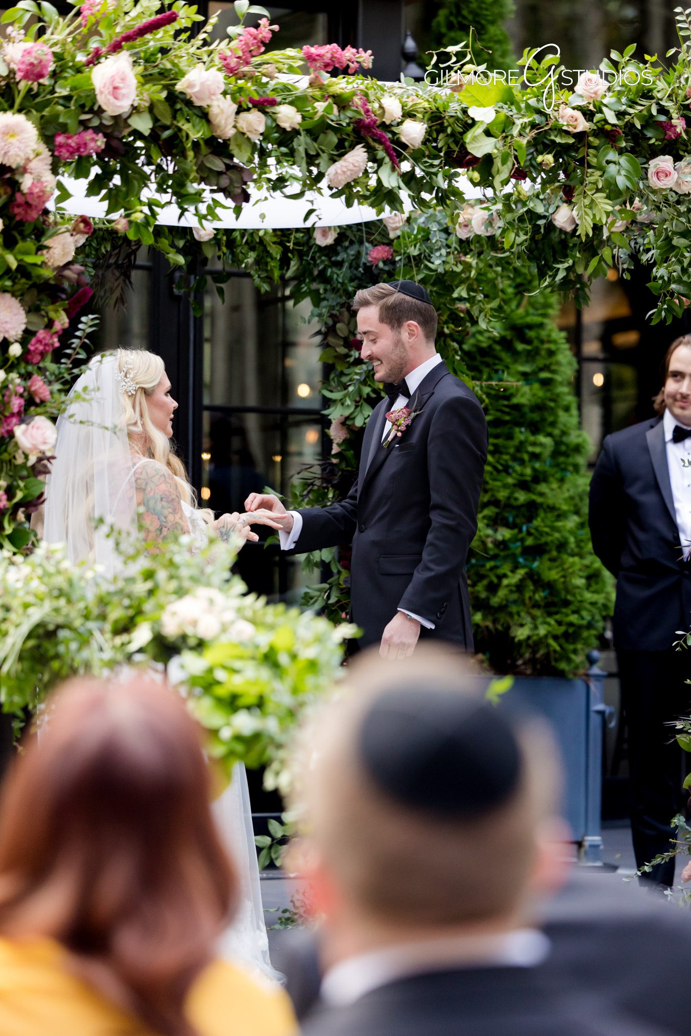 Candid family moments Shepherd’s Hollow Golf Club Michigan wedding Gilmore Studios
Bride and groom walking on golf course at Shepherd’s Hollow Michigan wedding