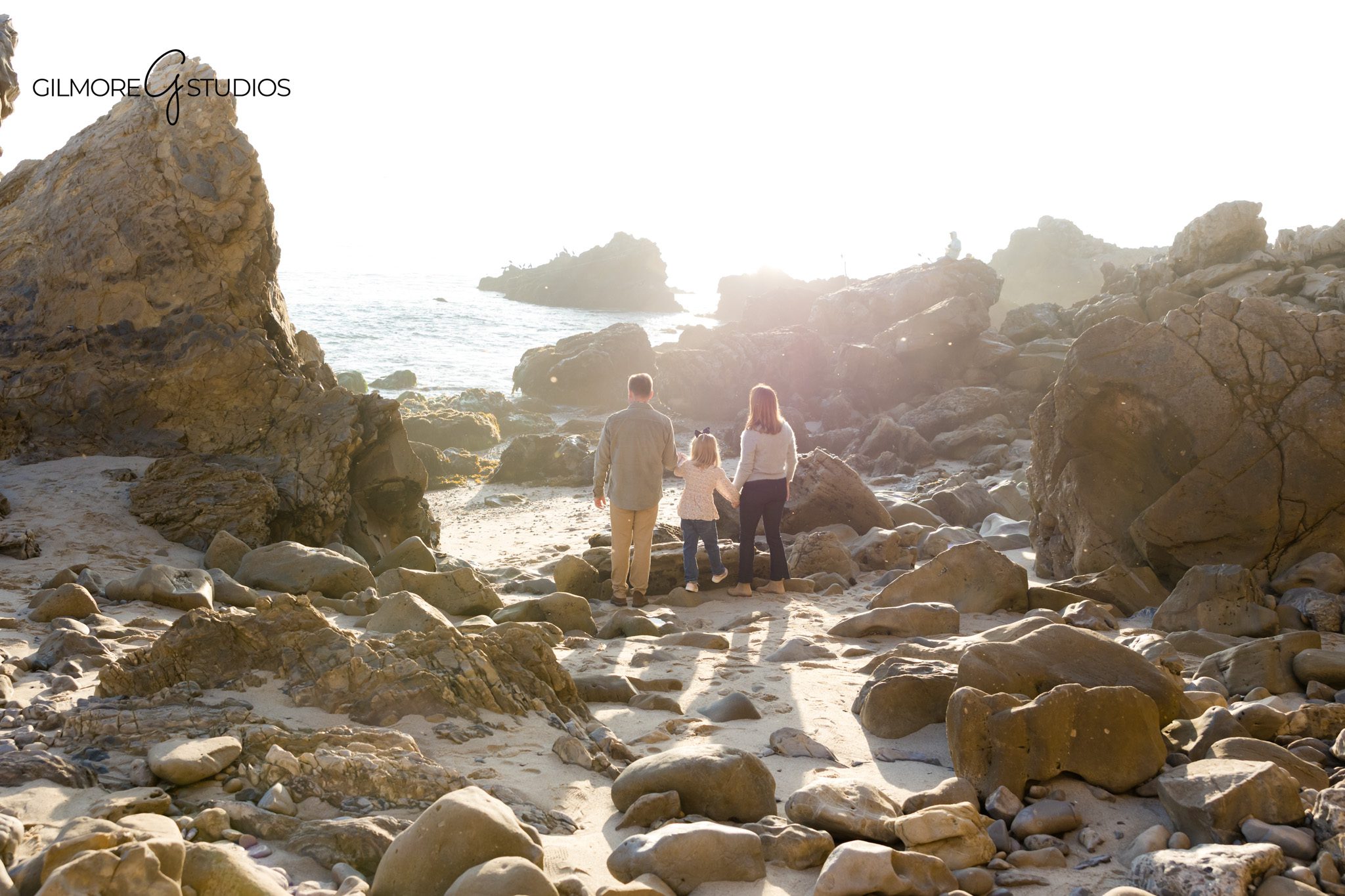 Family photography capturing toddlers playing near tide pools at CdM.

Corona del Mar portrait photographer capturing intimate parent-child moments.