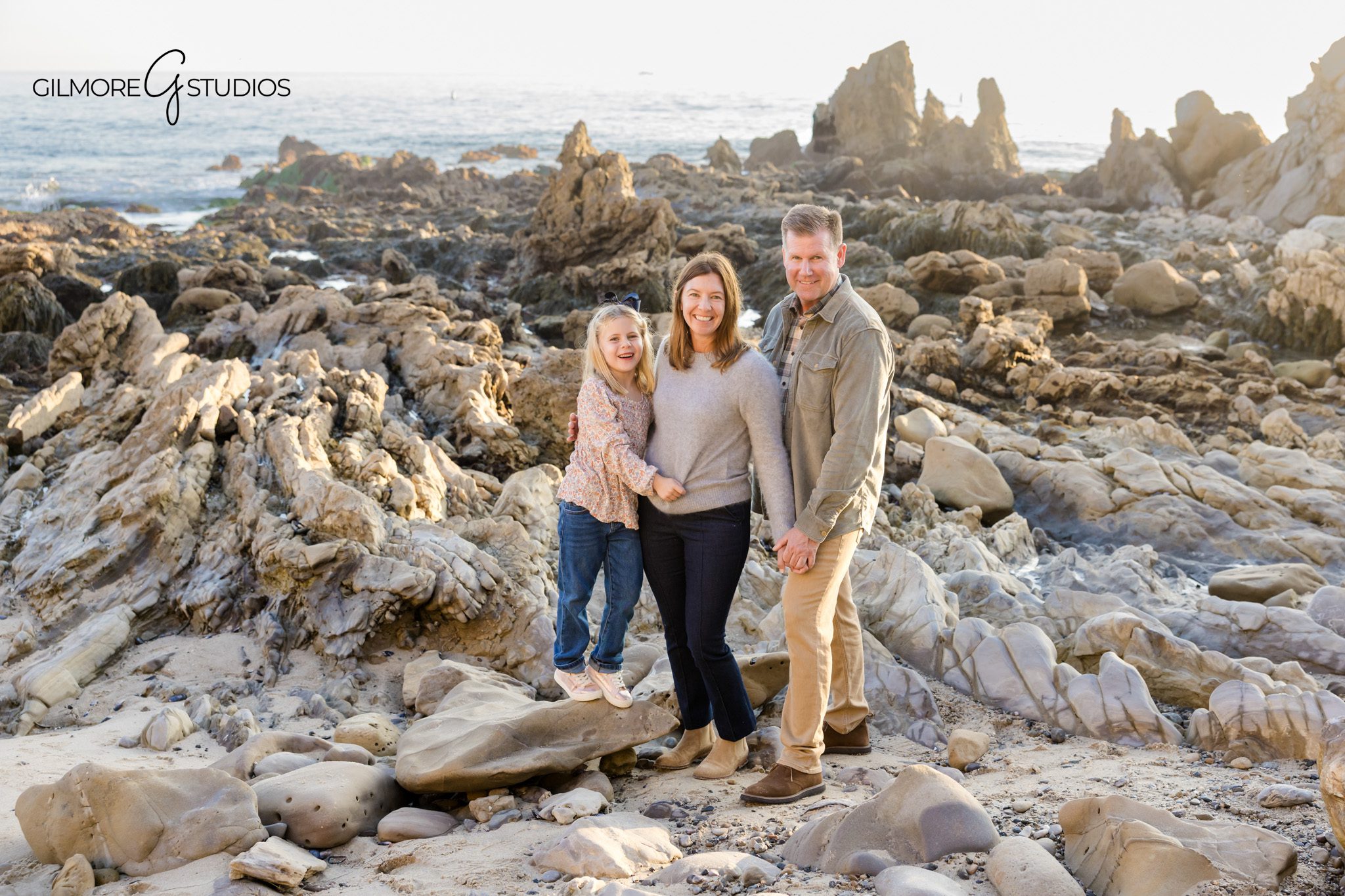 Orange County photographer capturing candid family moments at CdM beach.

Sunset beach family photography in Corona del Mar with soft golden light.