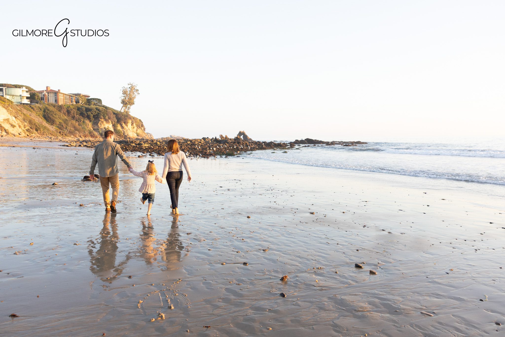 CdM beach photographer capturing siblings holding hands in the waves.

Natural light photographer capturing warm, coastal tones in family photos.