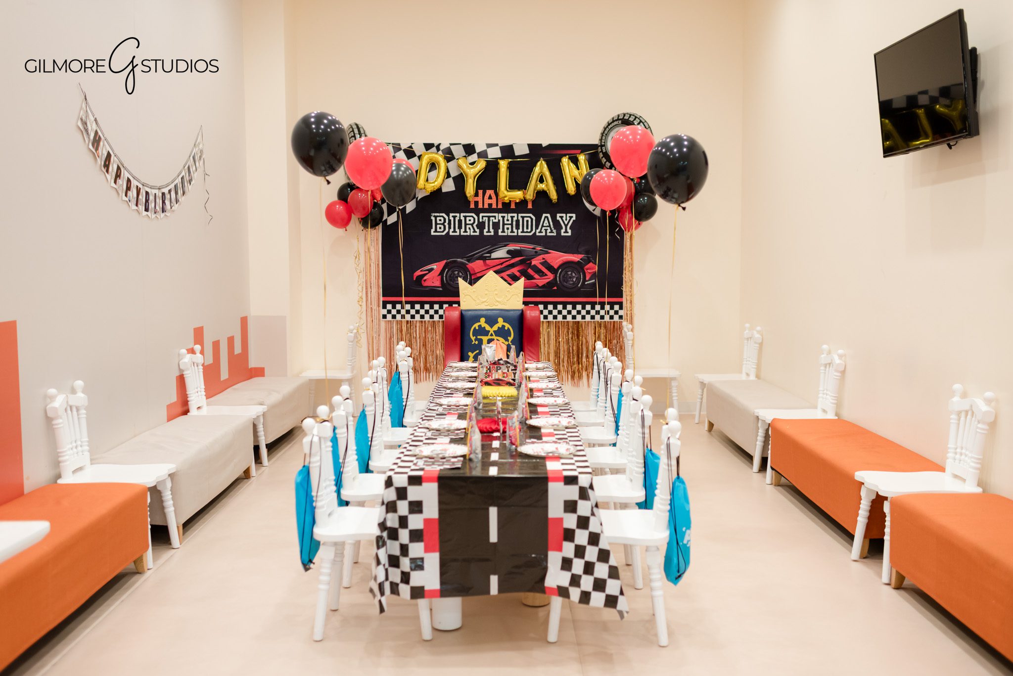 Gilmore Studios photographer capturing vibrant birthday celebration moments.

Photographer documenting grandparents enjoying child’s birthday celebration.