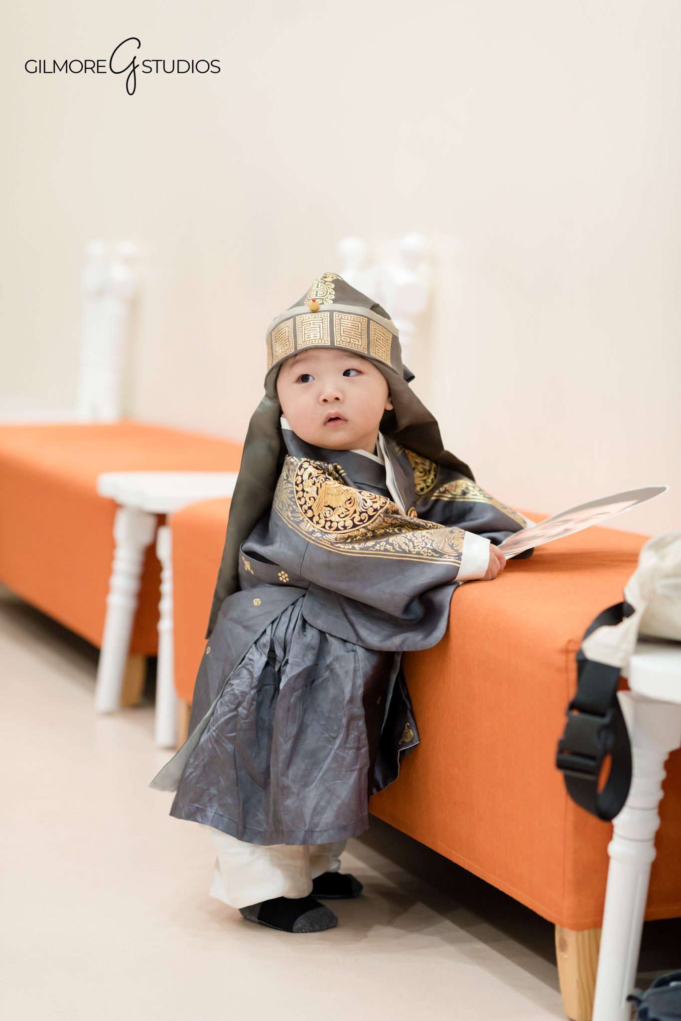 Birthday photographer capturing sweet moment between parent and child.

Children’s party photography showing toddlers sharing snacks at table.