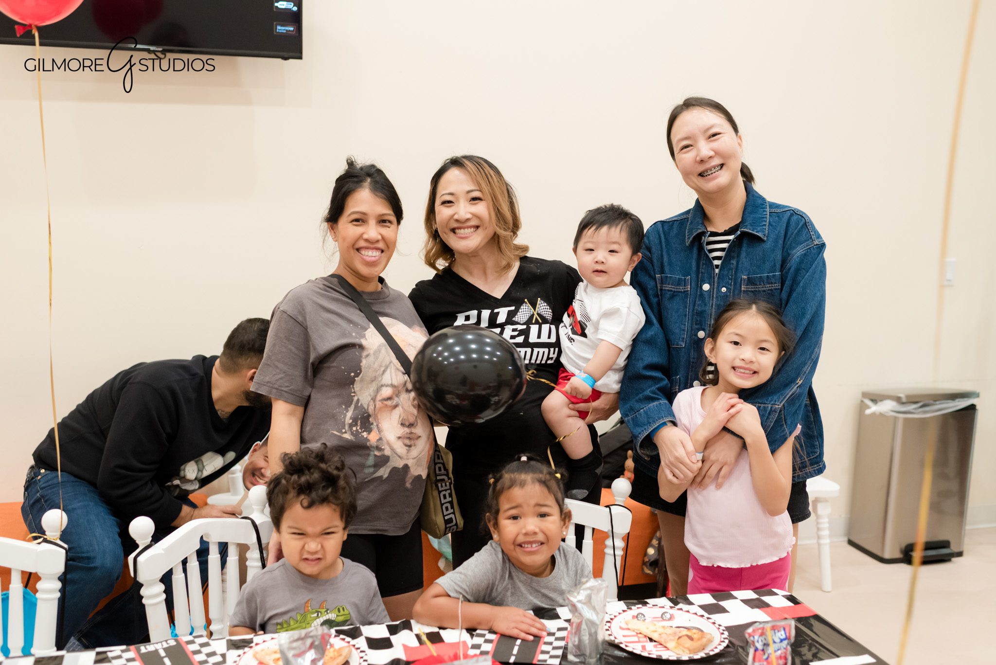Professional photographer documenting family portraits at birthday celebration.

PlayPie Buena Park birthday photography showing kids at snack table.