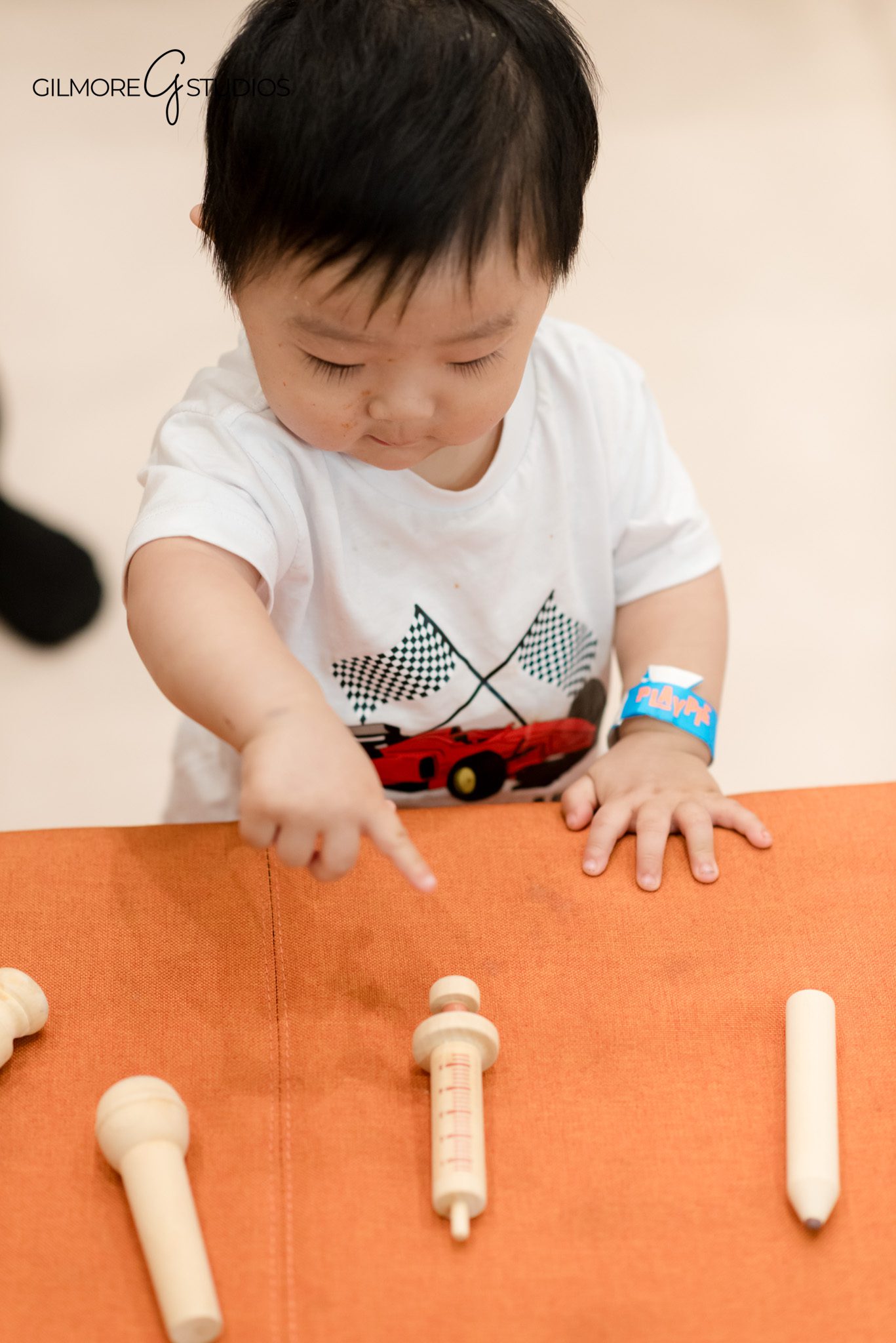 Professional portrait photographer capturing birthday child’s outfit details.

Candid event photography of kids sliding and climbing at PlayPie Buena Park.