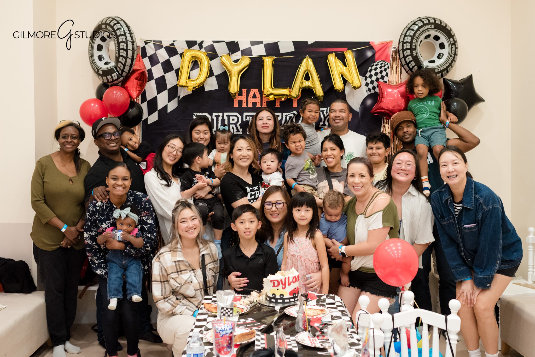 Birthday portrait photography showing child smiling near themed backdrop.

Event photographer capturing playful chaos during indoor birthday party.