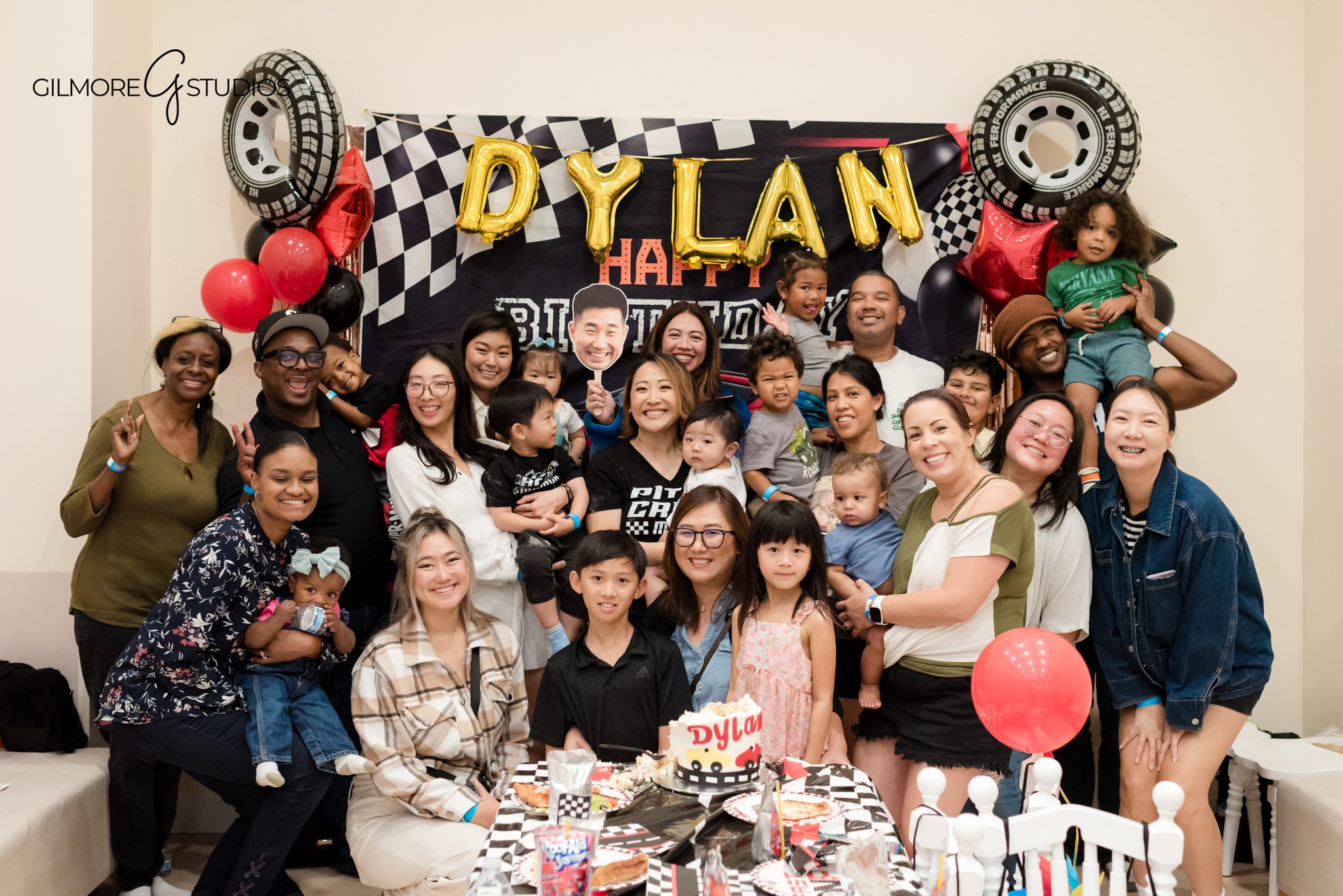 Southern California photographer documenting cake cutting at PlayPie birthday event.

Kids birthday photographer capturing playful moments on indoor play structure.