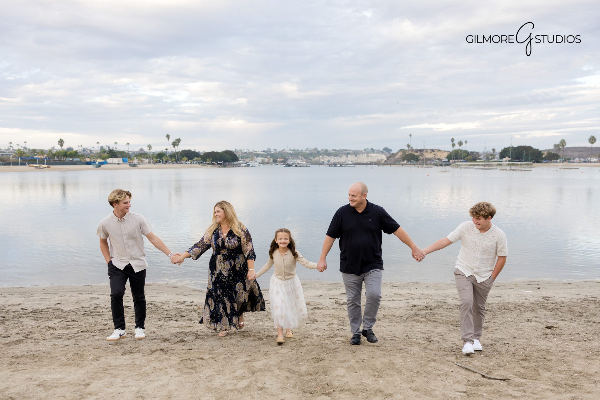 Malibu family photographer capturing coastal portrait at sunset.

LA family portrait photography with rolling hills in the background.