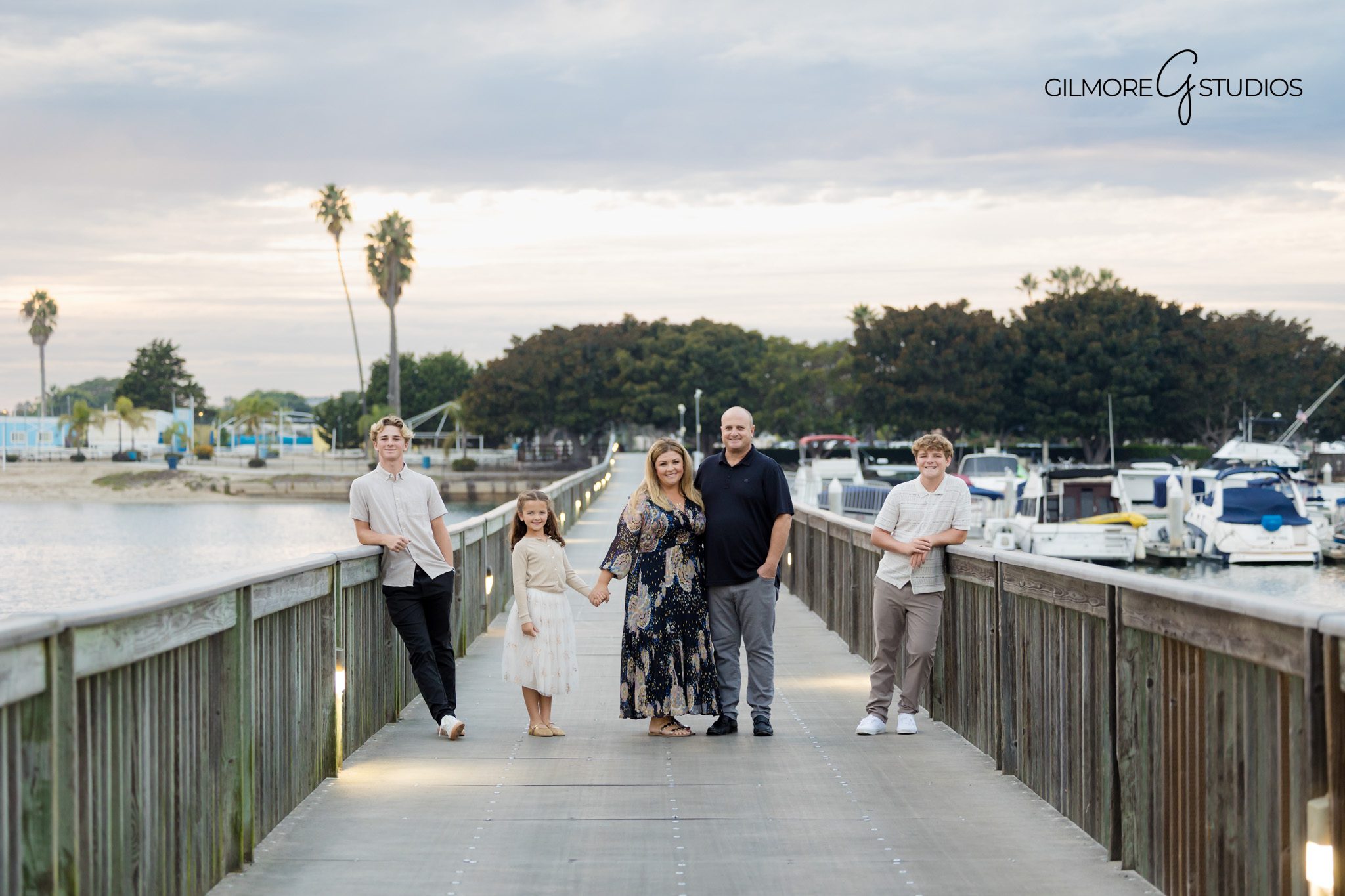 Family portrait photographer capturing soft warm tones in Los Angeles.

Los Angeles beach photography capturing candid family interaction.