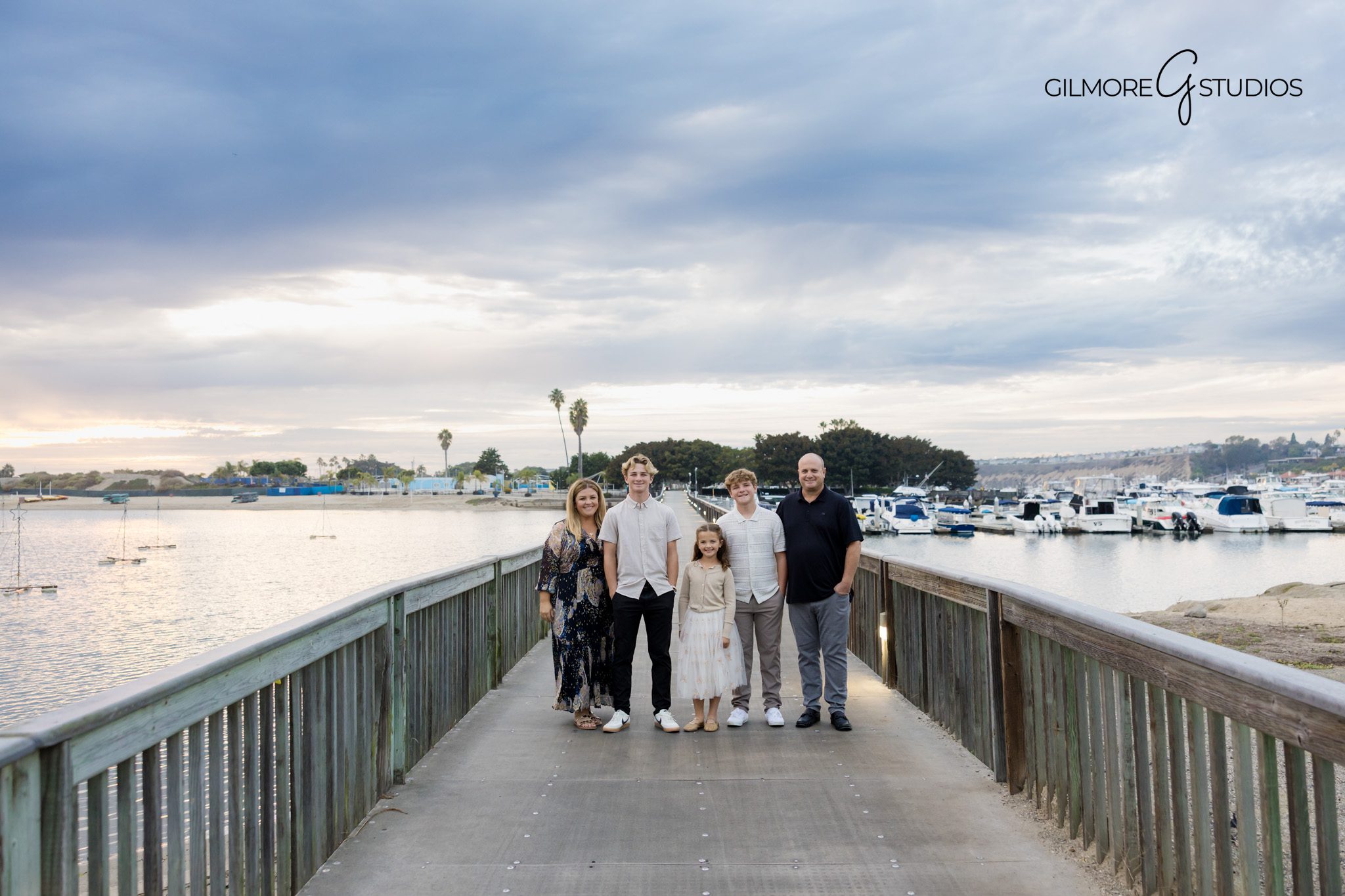 Griffith Park family photographer documenting playful candid moment.

Los Angeles photographer capturing parents holding hands with kids.