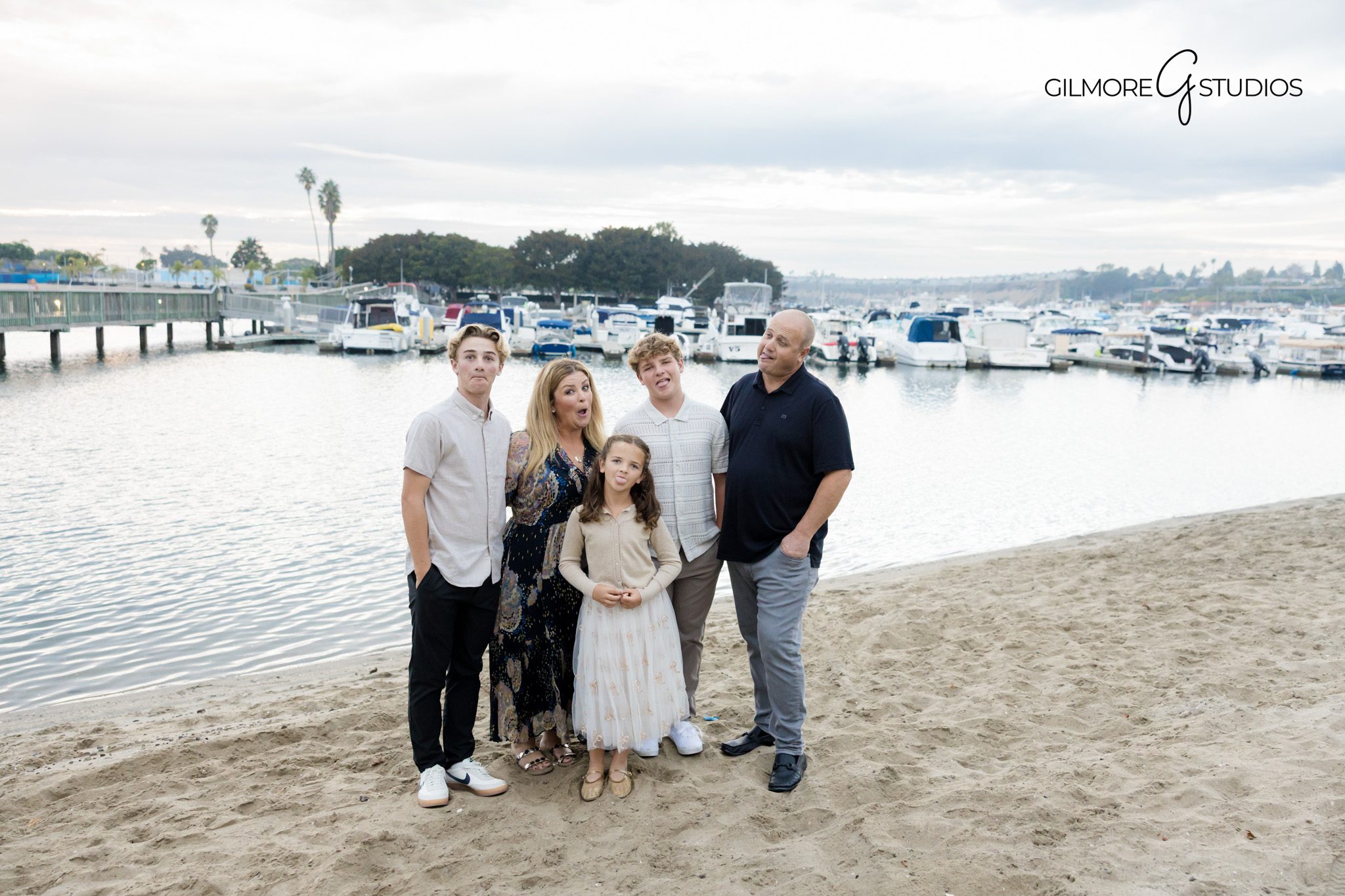 Los Angeles photographer capturing serene family portrait on grassy hill.

Family portrait photography near Echo Park Lake with greenery.