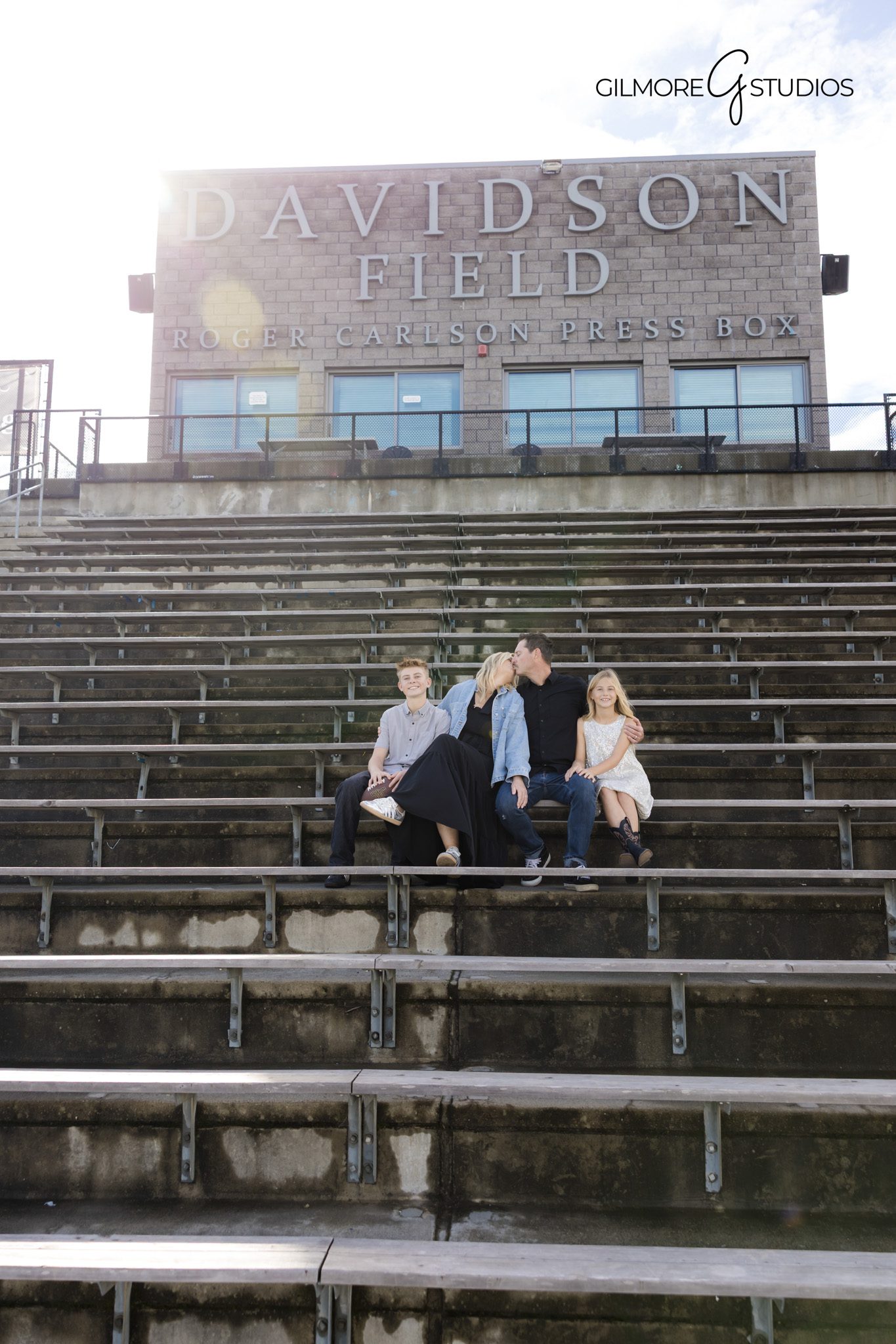 Orange County photographer capturing soft glow in family portraits.

Family photography featuring natural connection near shoreline.
