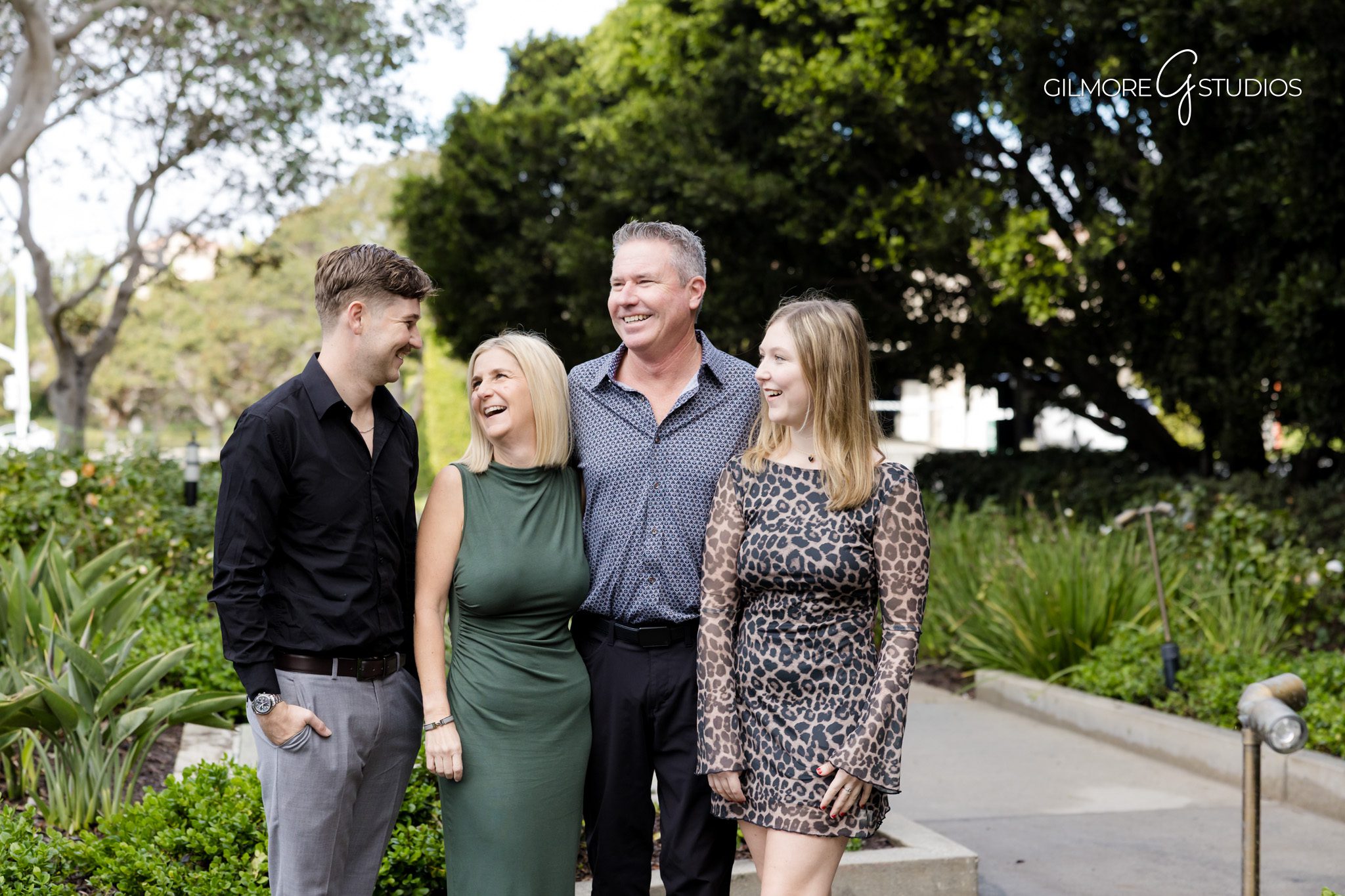 Newport Beach family portraits with rain-enhanced colors.

Rainy coastal portraits capturing kids splashing in puddles.