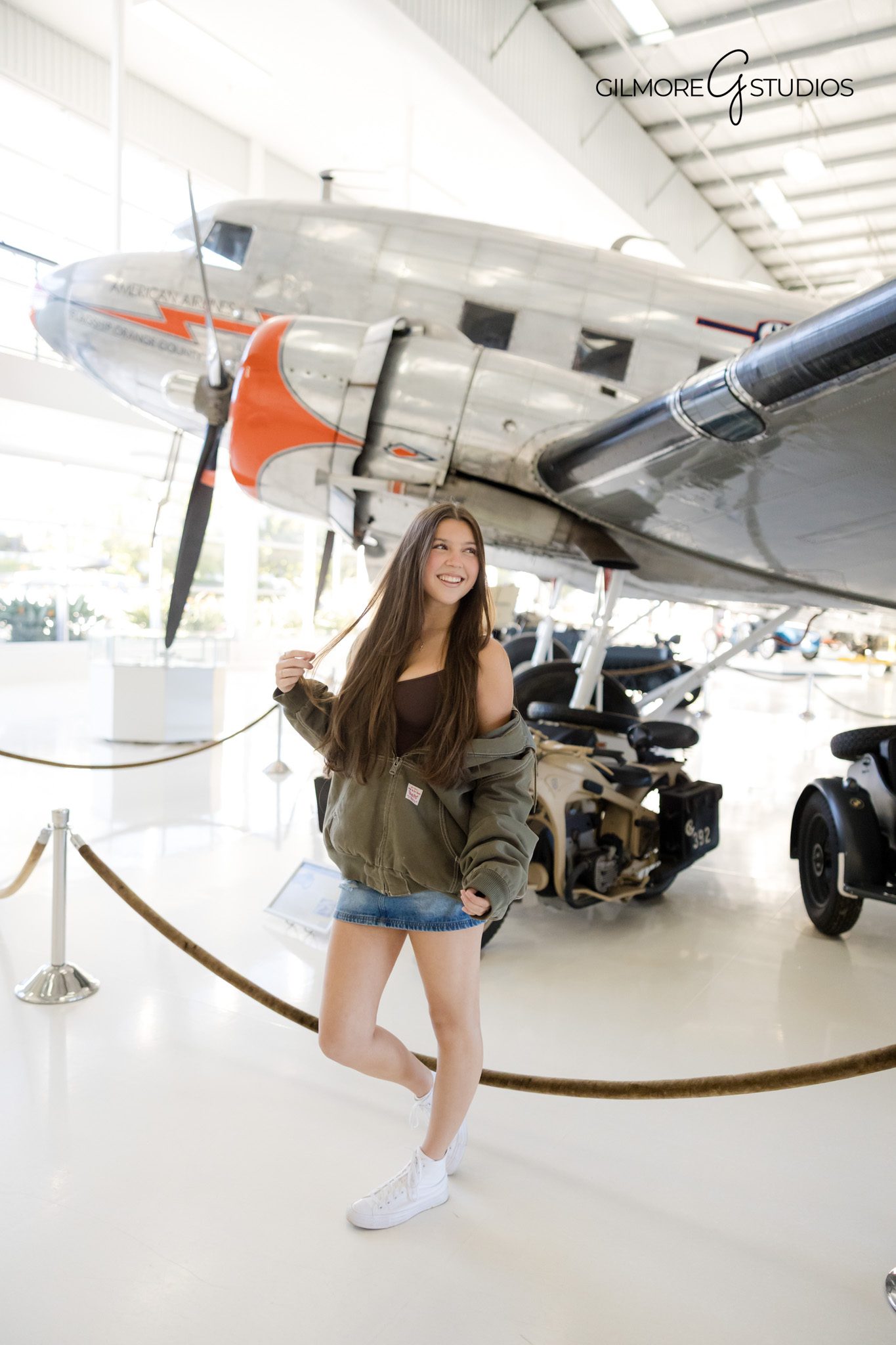 High school senior girl posing confidently at Lyons Air Museum
Indoor senior photoshoot at Lyons Museum Costa Mesa
