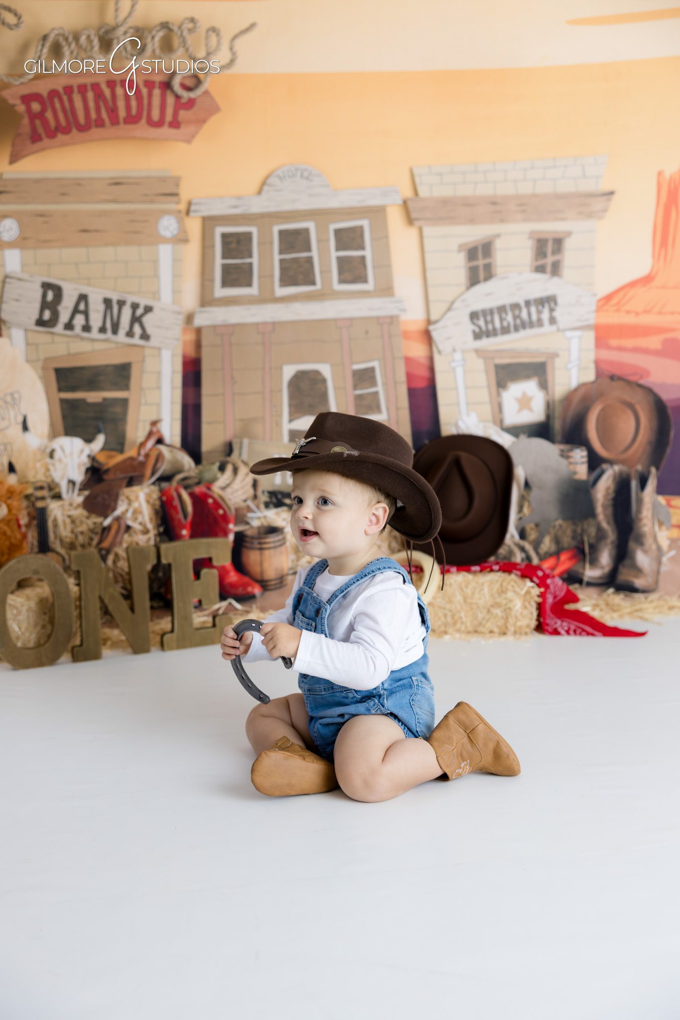 First birthday photographer documenting little cowboy cake smash,

Scottsdale baby portrait photographer capturing cowboy roundup theme,