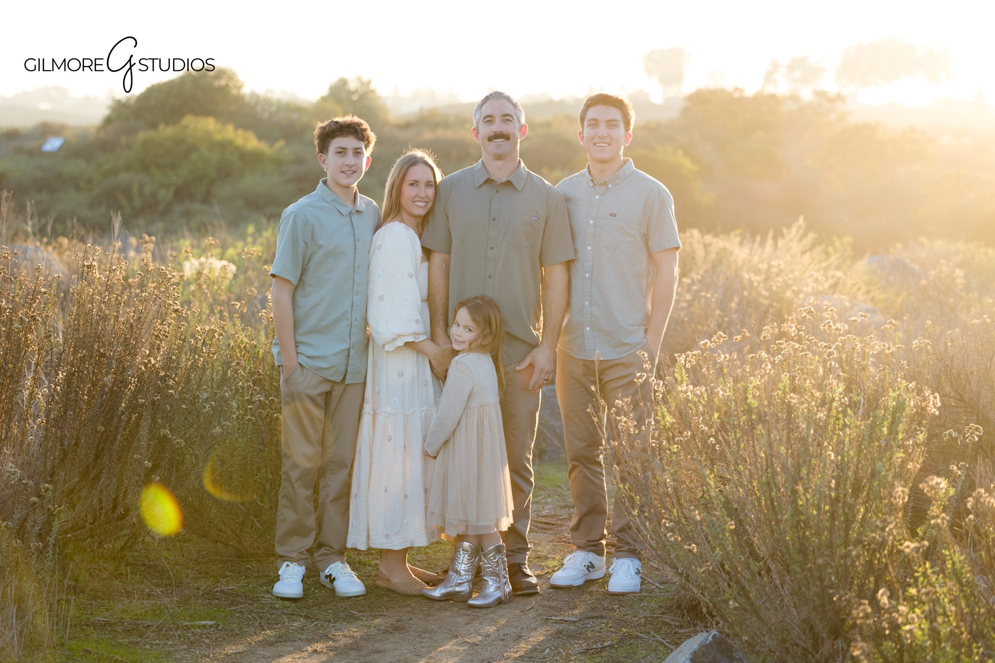 outdoor fall portraits with gilmore studios,

children playing on nature trail family session