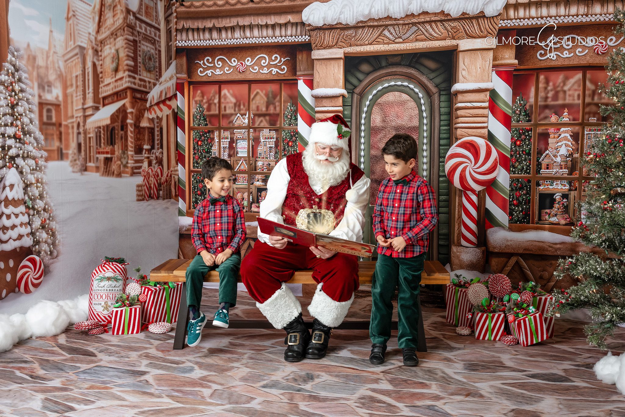 Christmas mini session photographer capturing family photos with Santa.

Santa photography session with children smiling during holiday portraits.