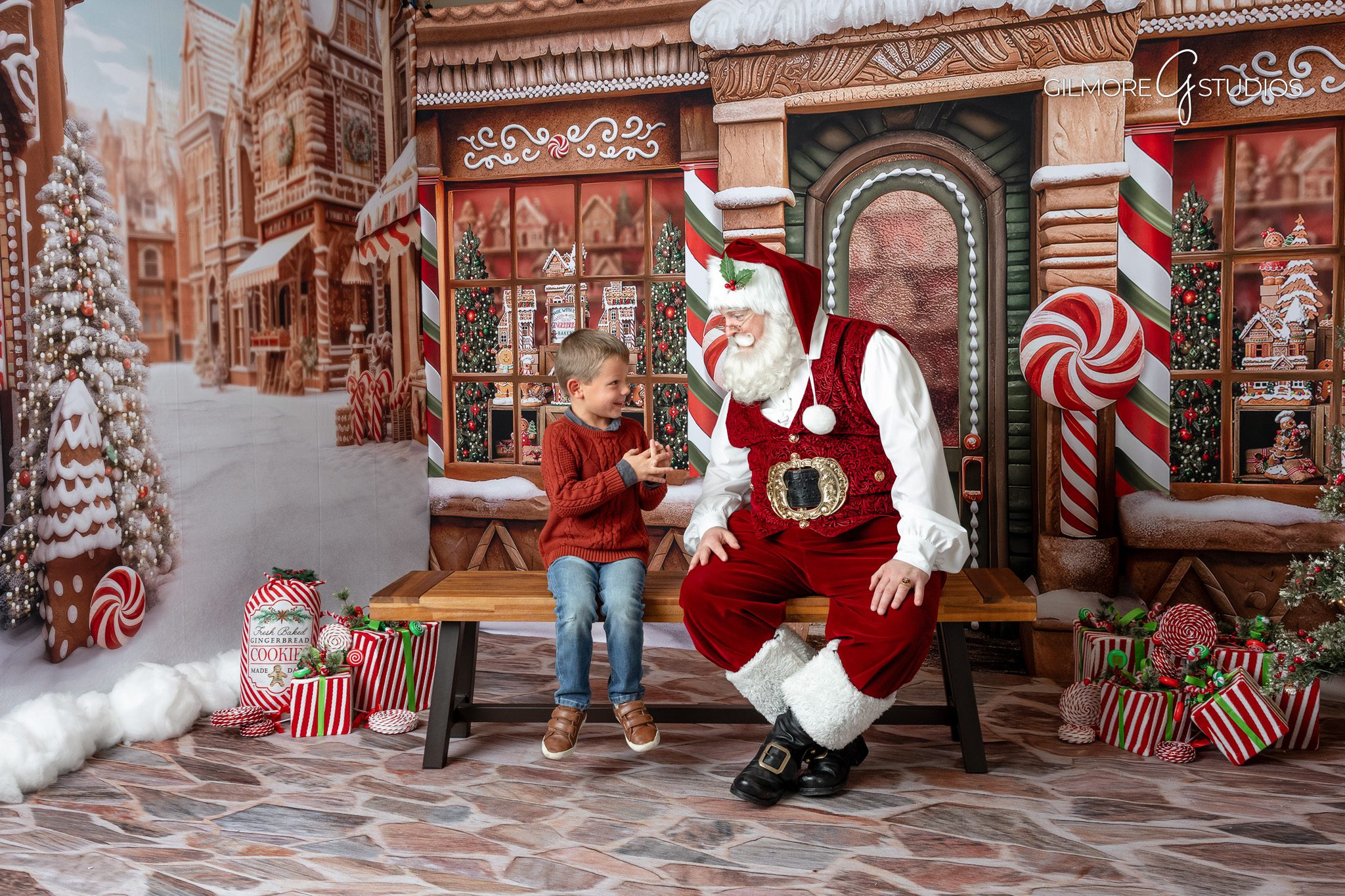 Santa mini session photographer capturing joyful family portraits in Orange County.

Christmas photography of children meeting Santa in Gilbert studio session.